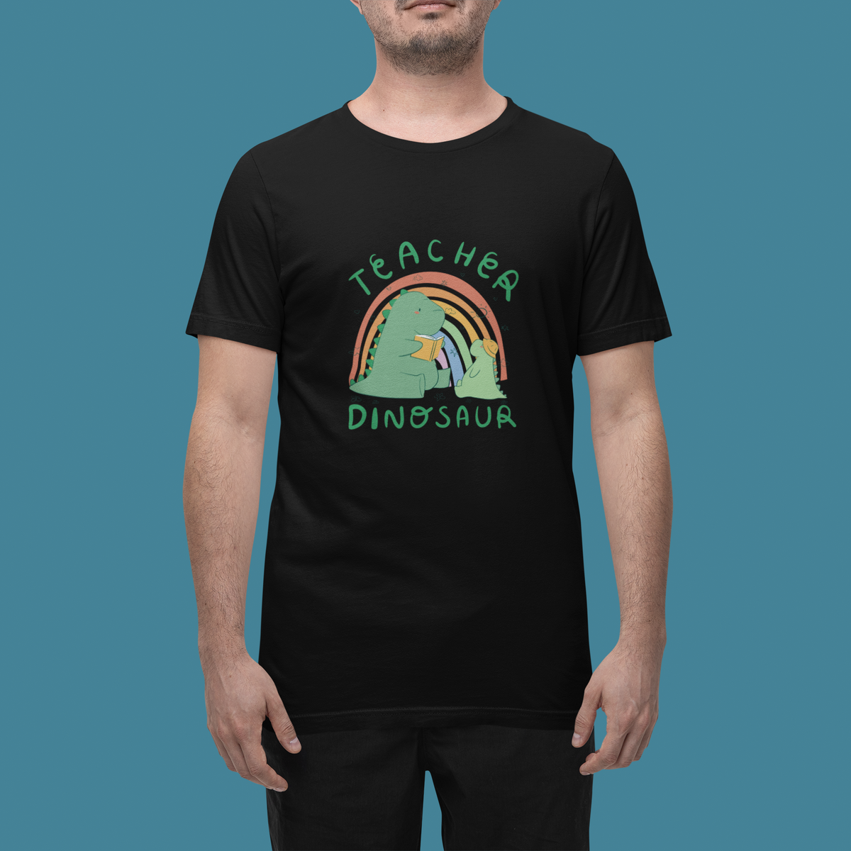 'Teacher Dinosaur' t-shirt in black, man in a studio