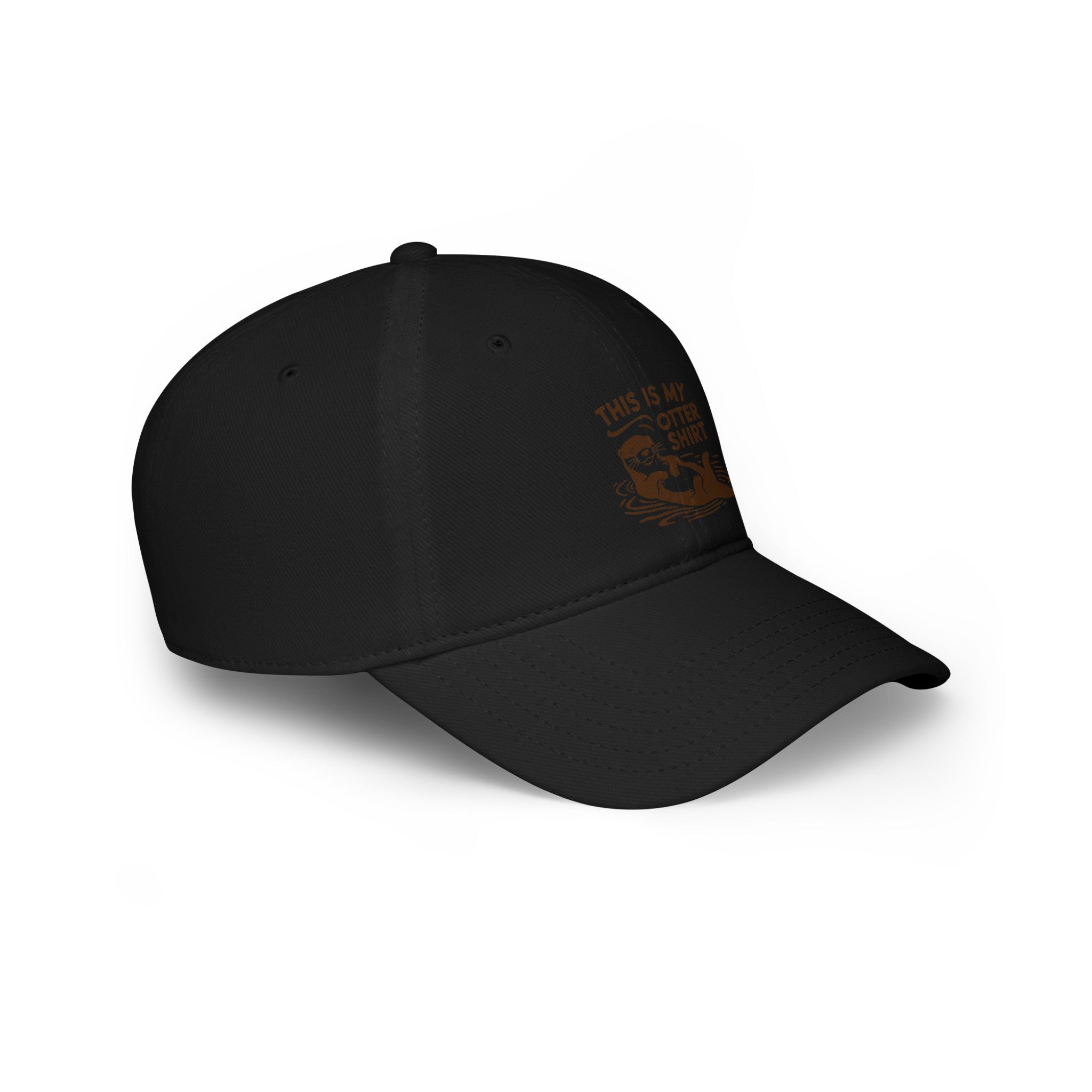 Black baseball cap with curved visor. Front design features a graphic and text saying, "My Otter Shirt - Hat." Offers exceptional comfort for everyday wear and a unique style perfect for any casual outfit.