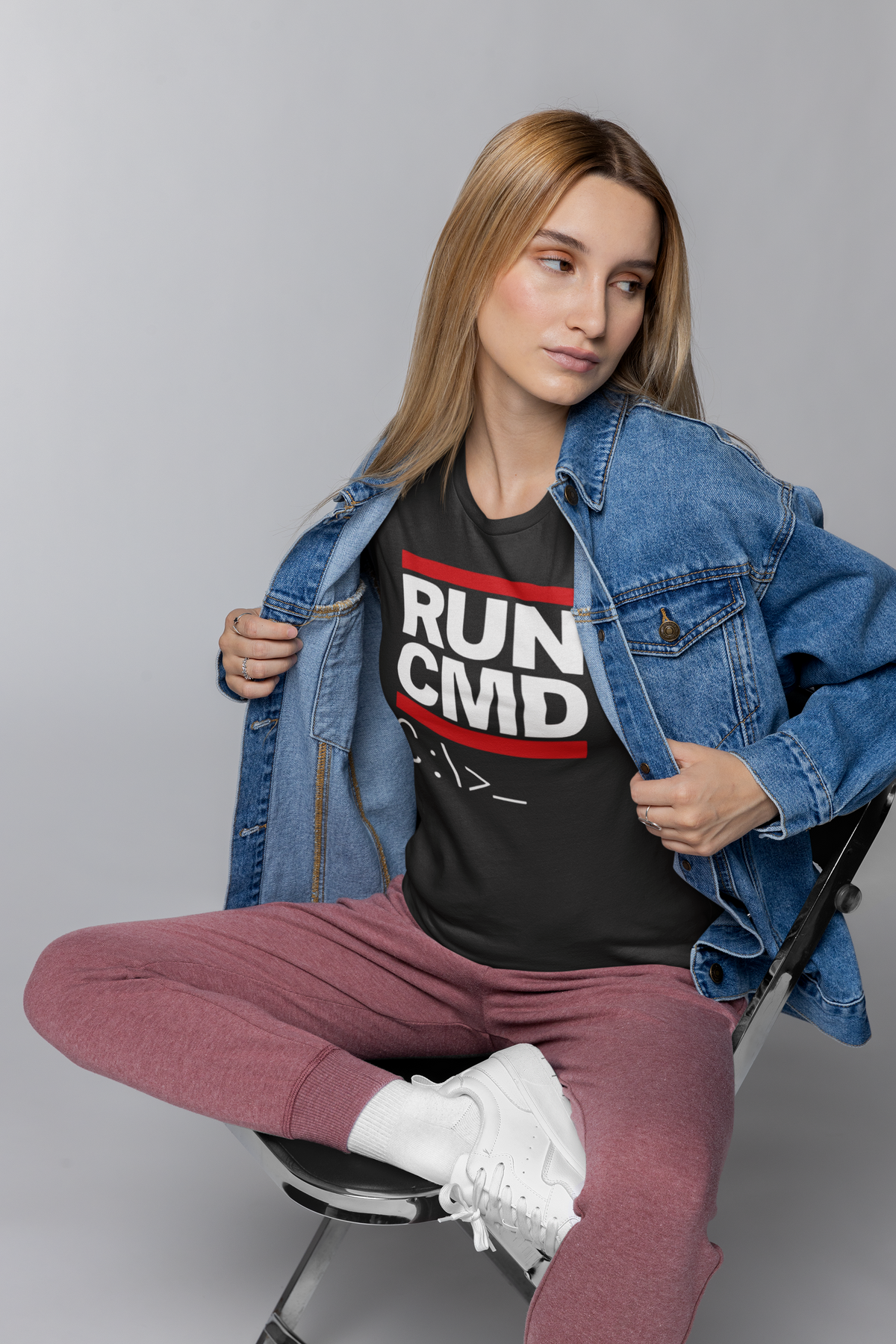 'Run CMD' terminal t-shirt in black, woman wearing it under a denim jacket, funny developer gift