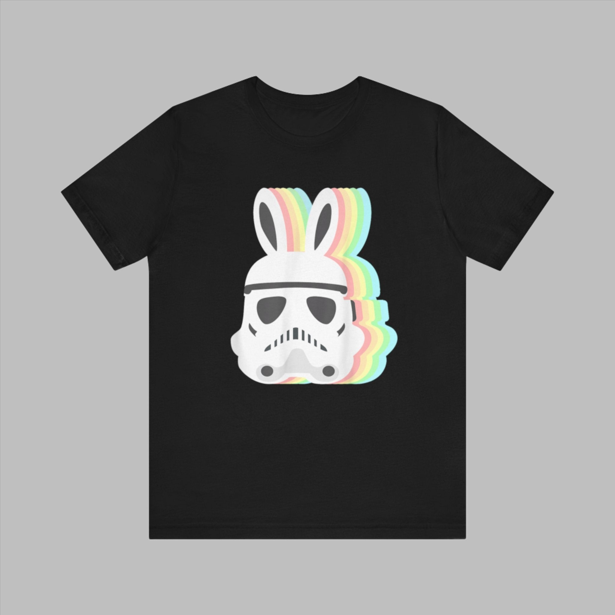 Black tee featuring a print of the Easter Stormtrooper Bunny helmet topped with rainbow-colored bunny ears.