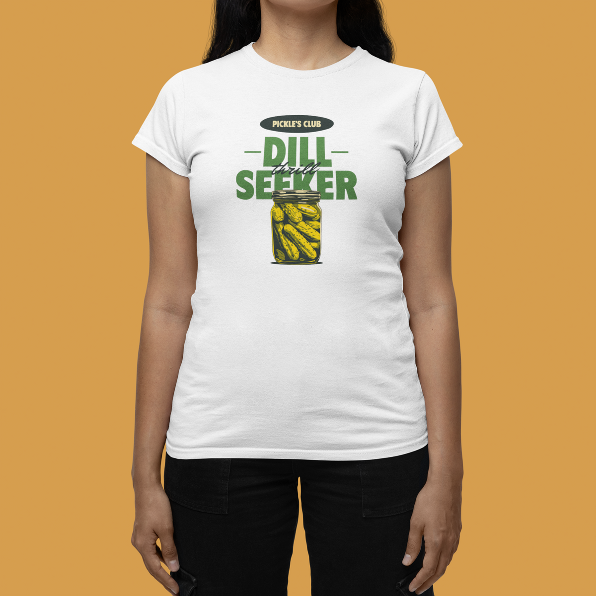 'Pickle's Club Dill Seeker' women's tee in white, woman wearing it against a yellow backdrop, funny pun gift