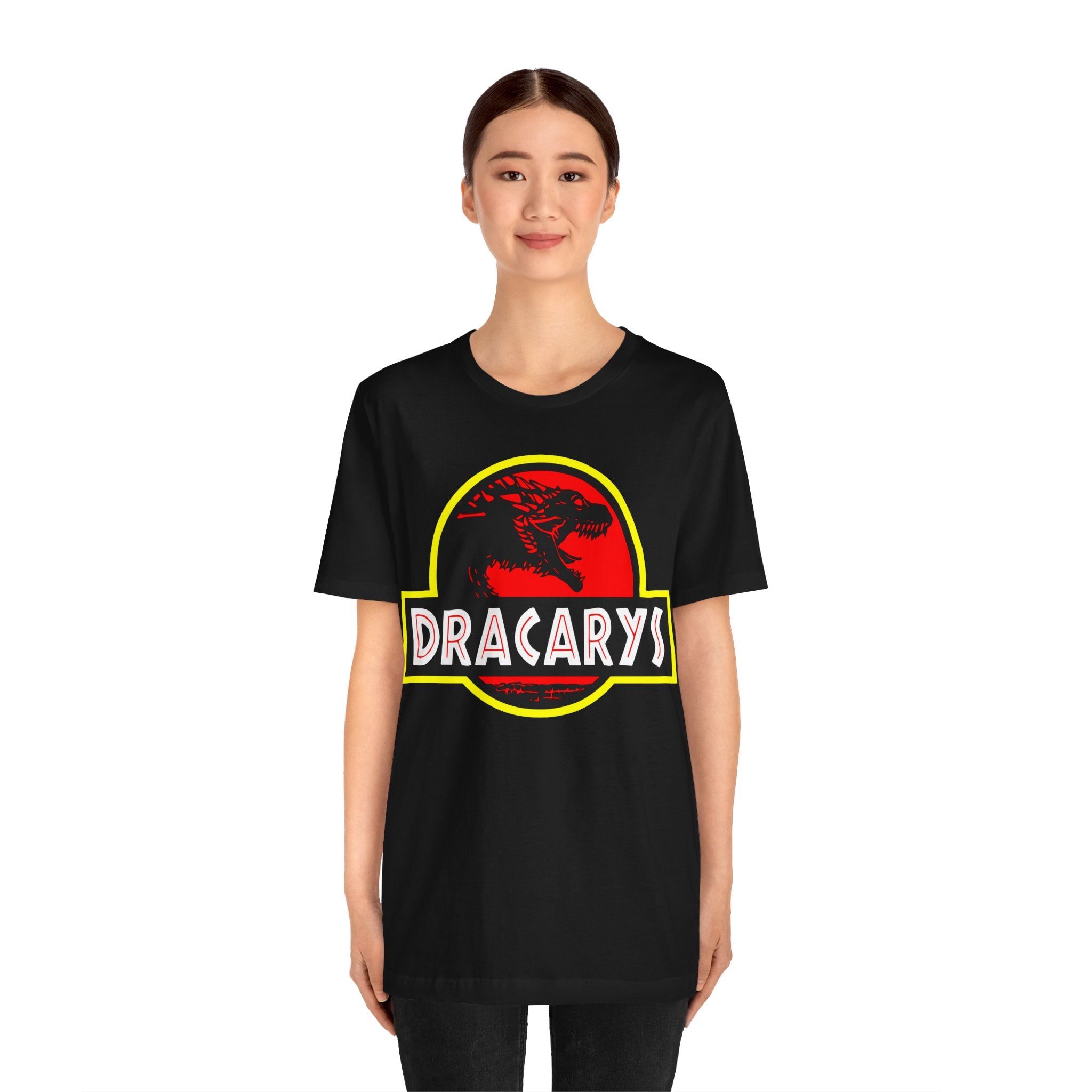 A young woman wearing a black classic Dracarys T-shirt with a red and yellow "Dracarys" logo featuring a quality print of a dragon silhouette.