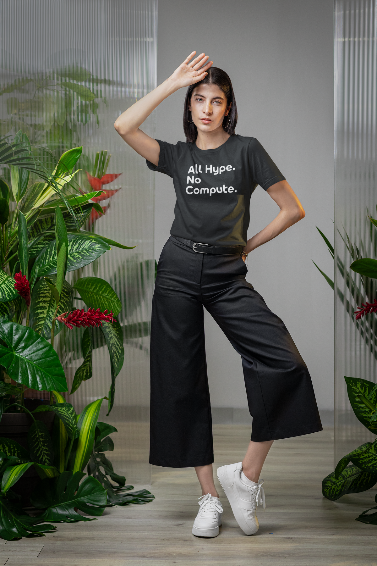 'All Hype. No Compute.' t-shirt in black, woman wearing it in a tropical plant setting, funny programmer shirt