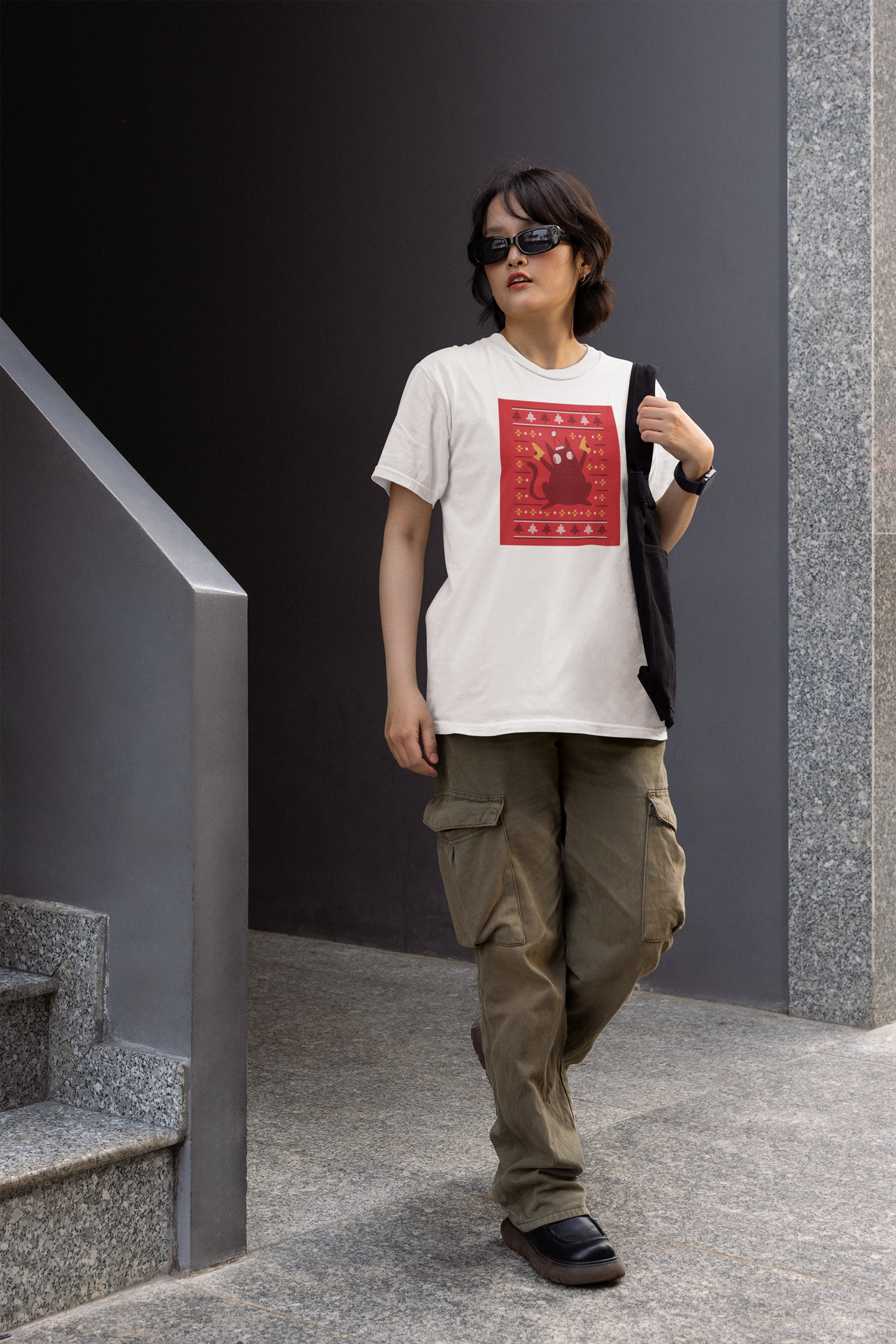 Ugly Sweater Cat Women's T-Shirt in white, woman walking outdoors wearing it, funny cat lover gift