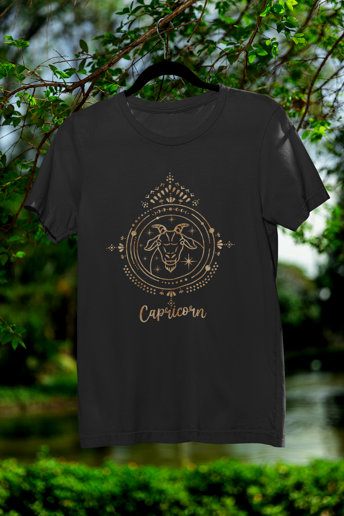 Capricorn zodiac T-shirt in black, hanging outdoors among trees, astrology lover gift shirt