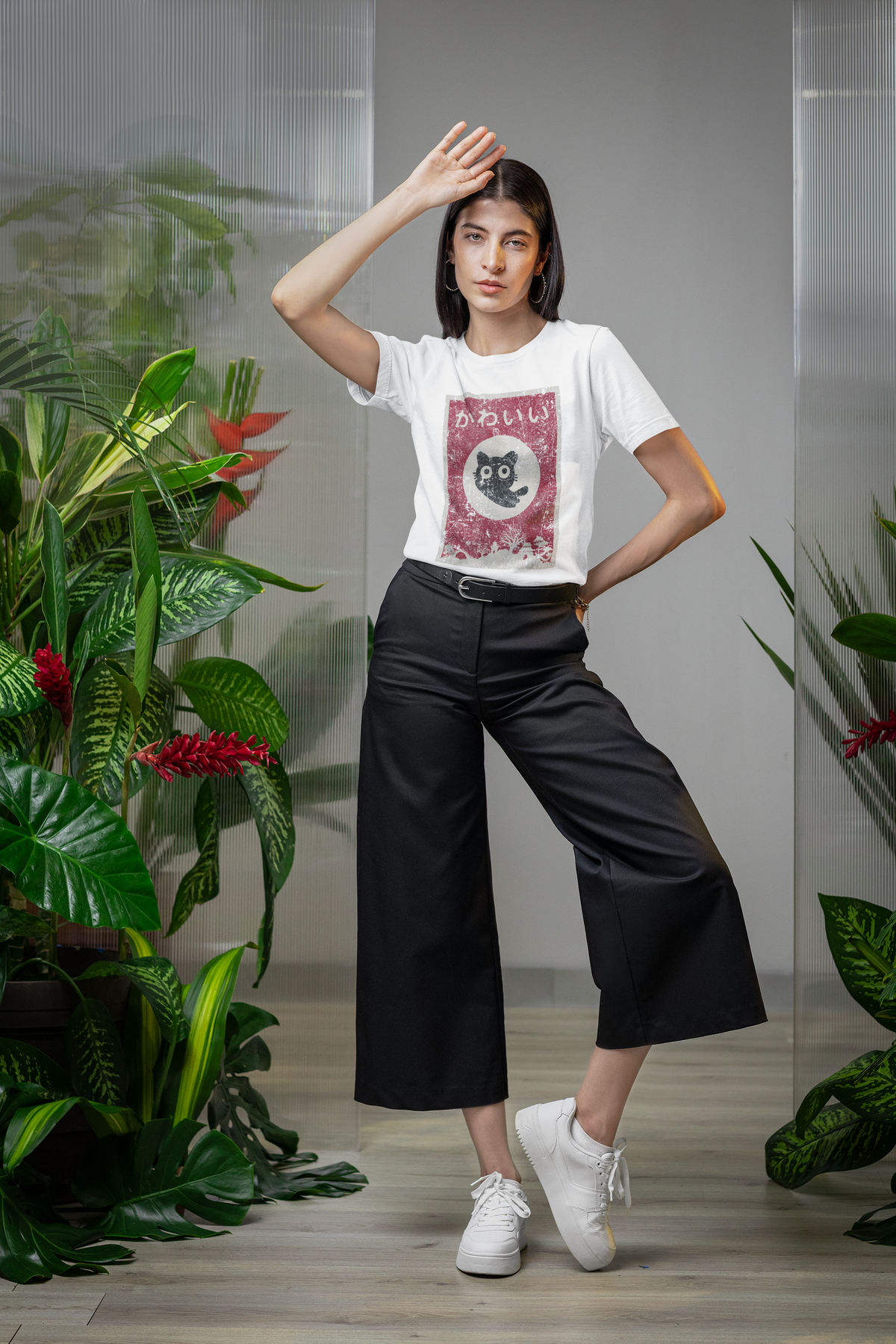 "Kawaii" cat anime poster graphic t-shirt in white, woman wearing it with plants background, cute anime lover gift