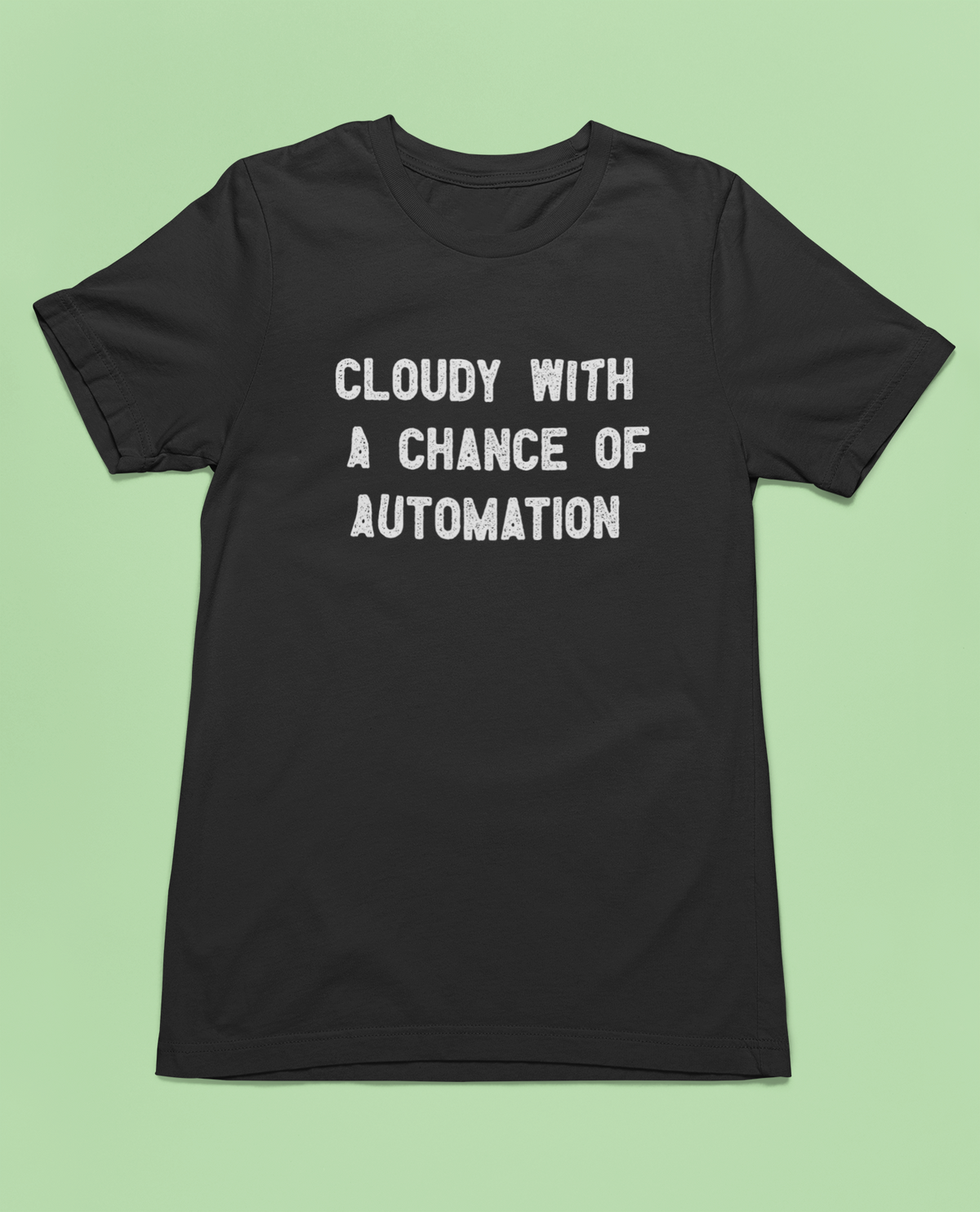 Cloudy With a Chance of Automation t-shirt in black, back print flat lay on green background, funny tech gift