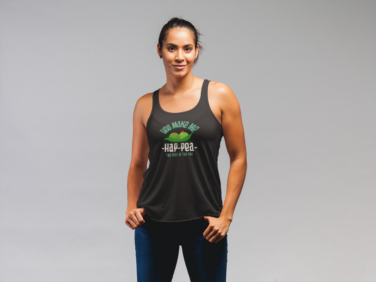 'You Make Me Ha-Pea' pea pun tank top in black, woman wearing it, grey backdrop, veggie pun gift