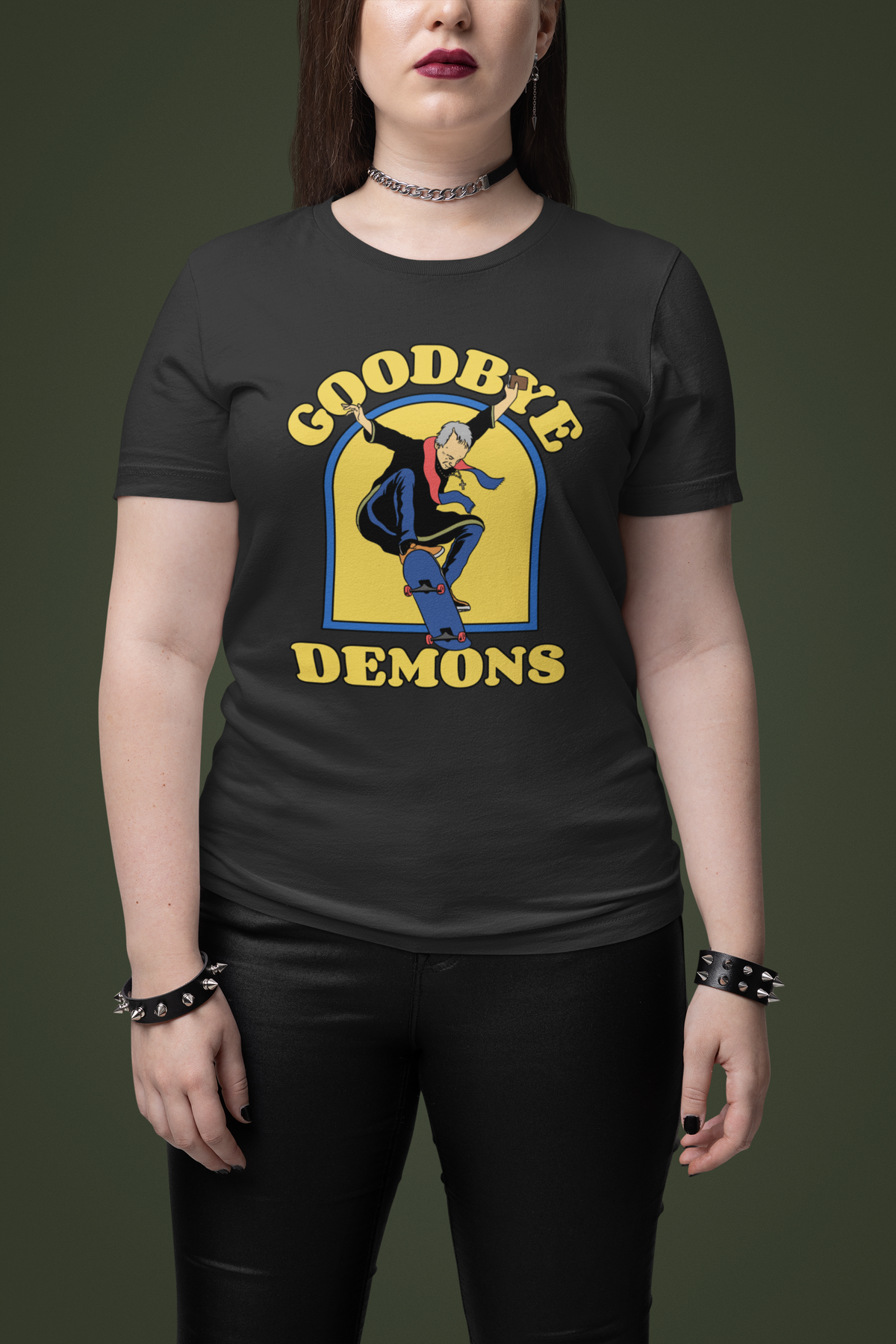 'Goodbye Demons' exorcist graphic t-shirt in black, woman wearing it on dark green background, funny gift