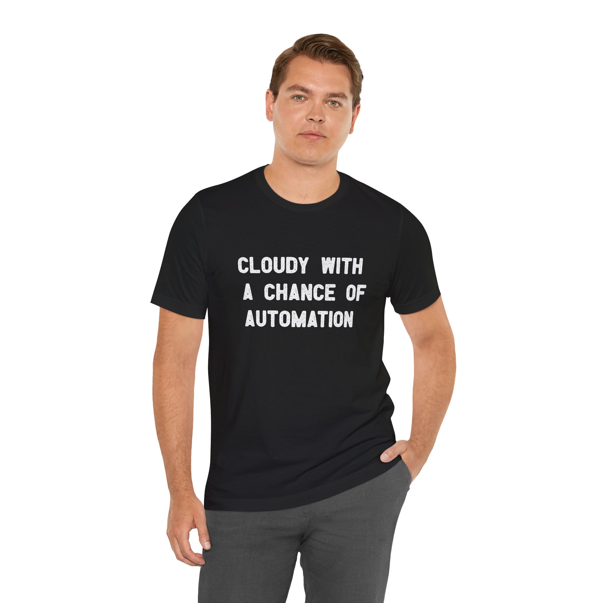 A person wearing a "Cloudy With a Chance of Automation" t-shirt, featuring black Airlume cotton, stands with a neutral expression.