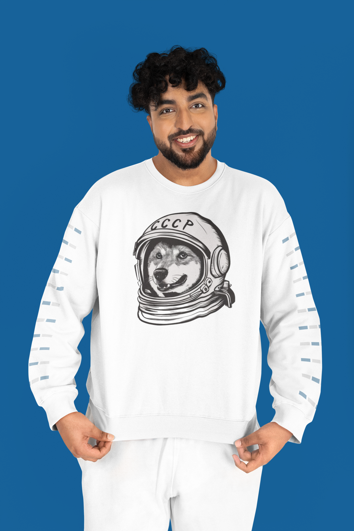 'CCCP Astronaut Dog' sweatshirt in white, man wearing it against a blue backdrop, funny retro space dog gift
