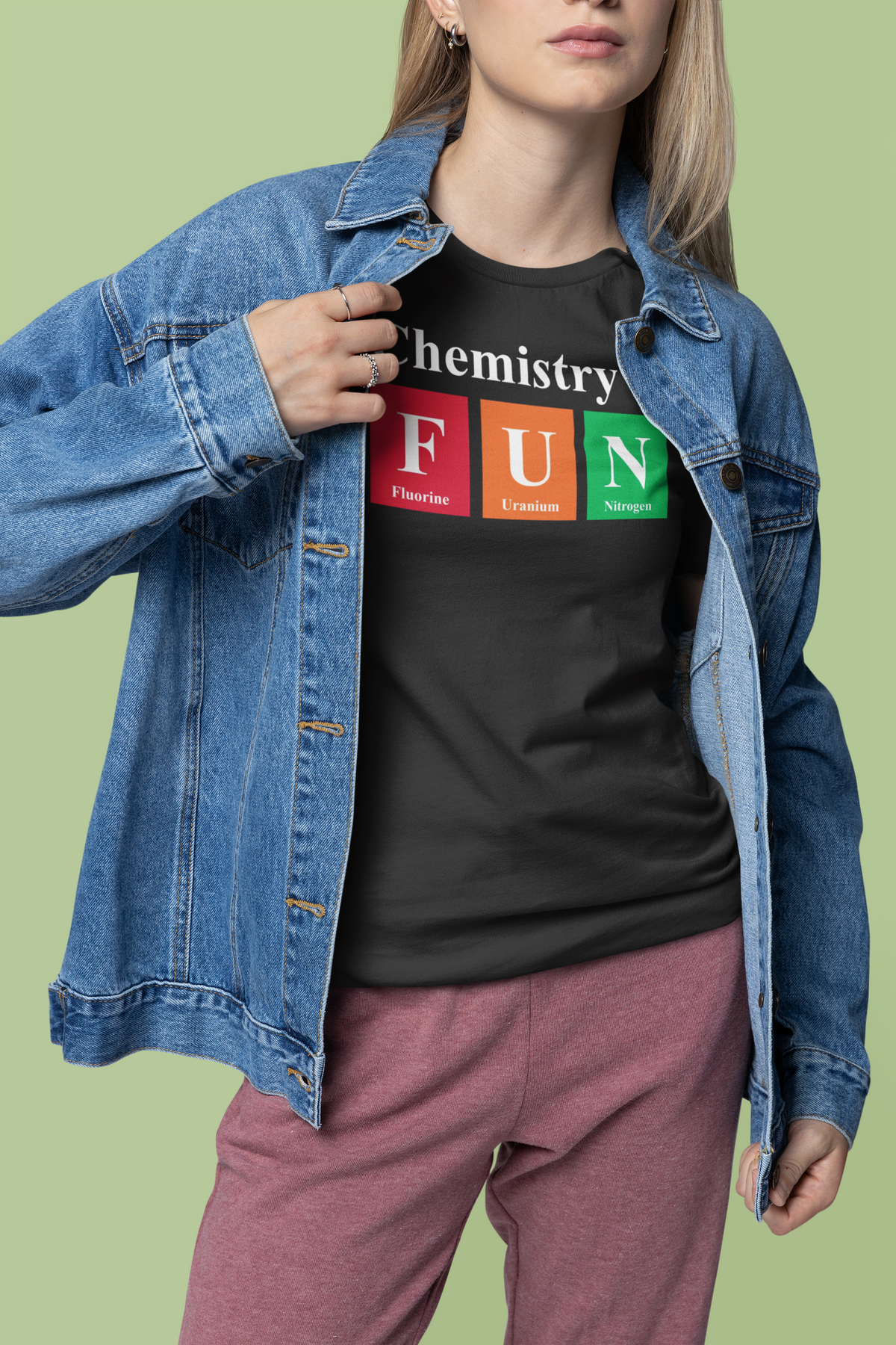 'Chemistry is FUN' graphic t-shirt in black, woman wearing it with denim jacket, funny chemistry pun gift
