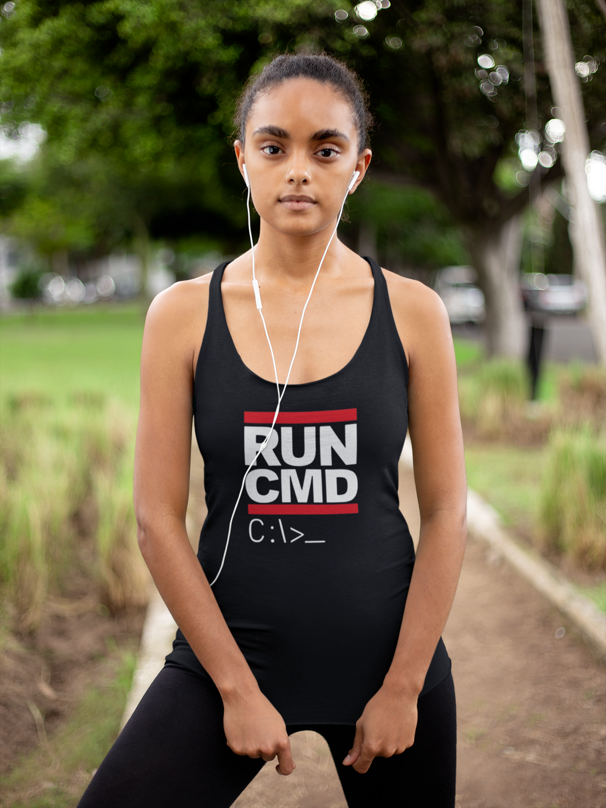 'RUN CMD Women's Tank' in black, woman in a park, Tank Top mockup, Geekpsters