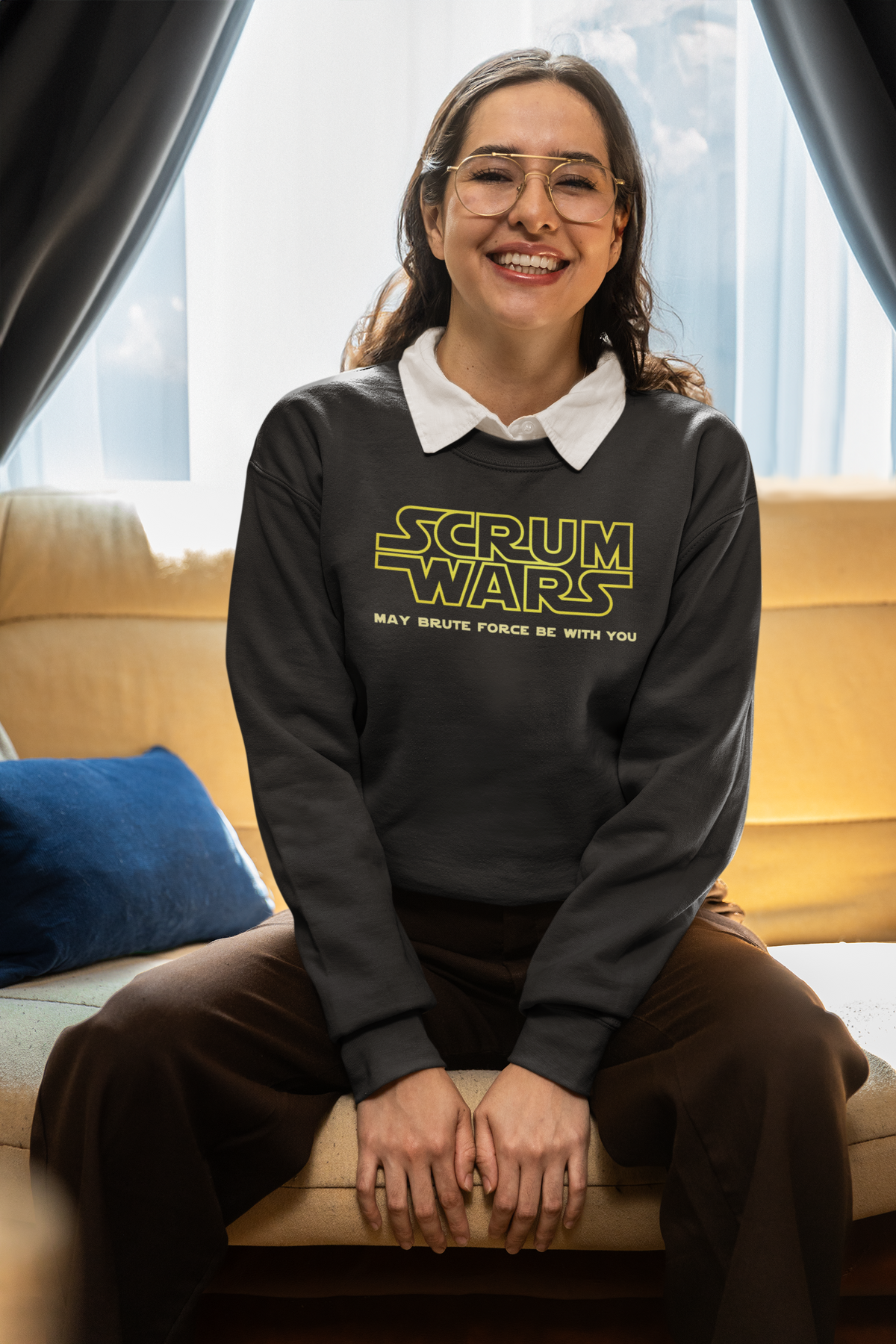 "Scrum Wars" sweatshirt in olive, woman wearing it indoors, funny gift for agile developers