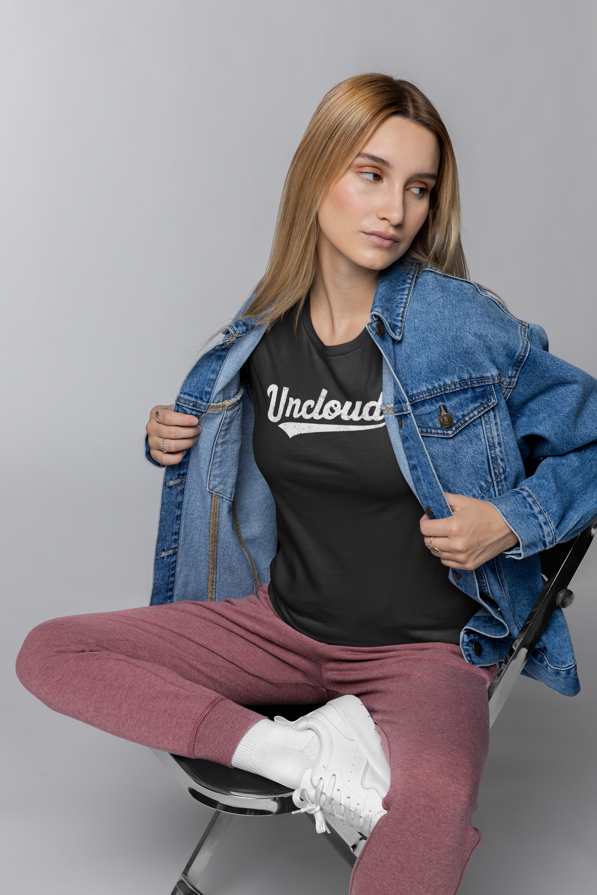'Uncloud' script logo t-shirt in black, woman wearing it under a denim jacket, funny gift for developers