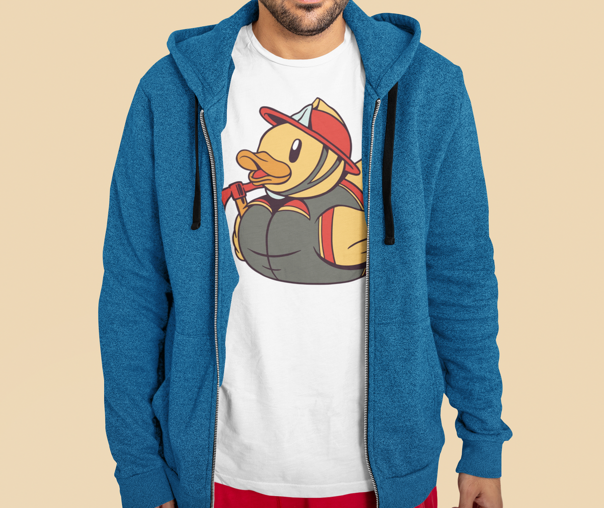 Firefighter duck t-shirt in white, man model wearing it under a blue zip hoodie, funny firefighter gift