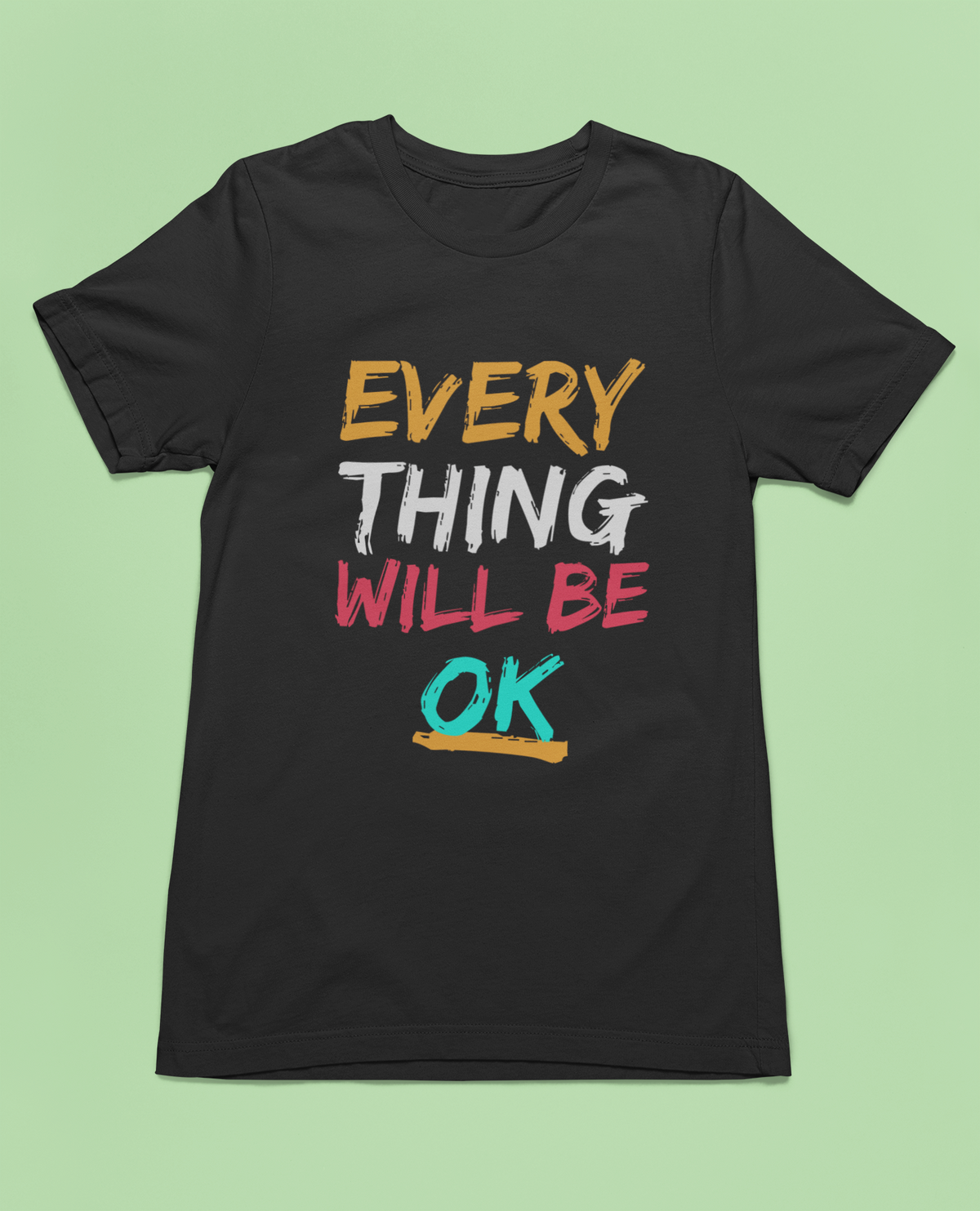 'Everything Will Be OK' T-shirt in black, styled flat lay with sneakers and denim, uplifting gift