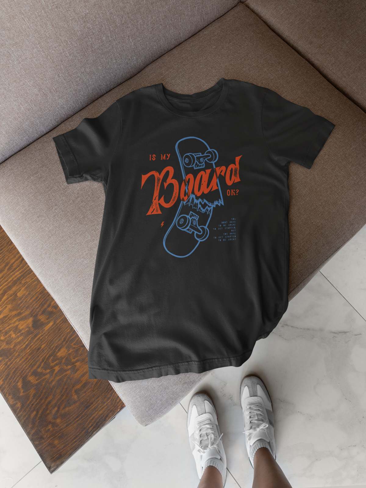 "Is My Board OK?" skateboard t-shirt in black, folded flat lay on floor, funny skater lifestyle gift