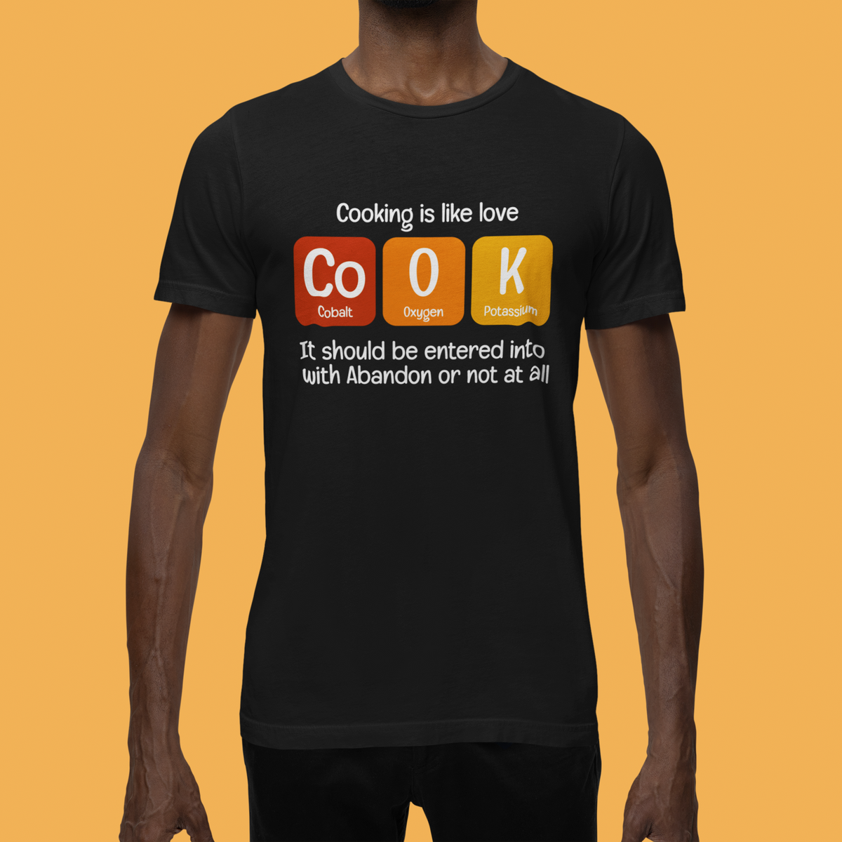 Co-O-K periodic table cook element pun graphic tee, worn outdoors by model