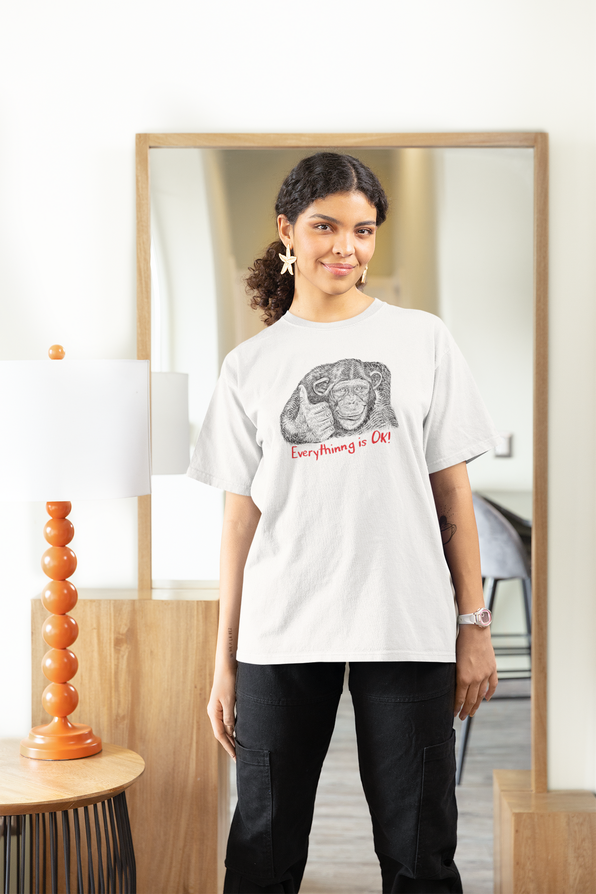 'Everything is OK' monkey women's t-shirt in white, woman wearing it at home, sarcastic gift