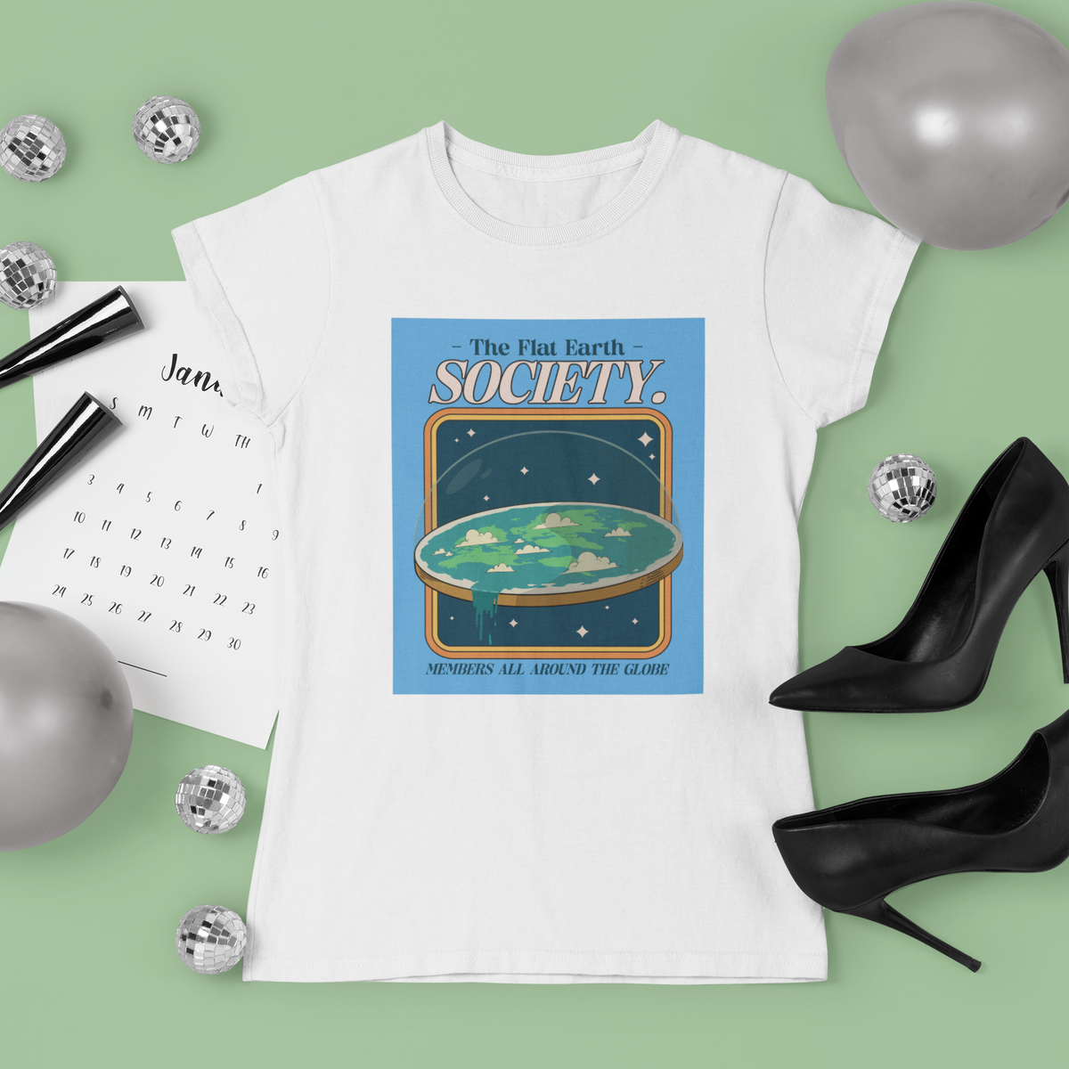'The Flat Earth Society' t-shirt in white, styled flat lay with heels, funny satire gift idea