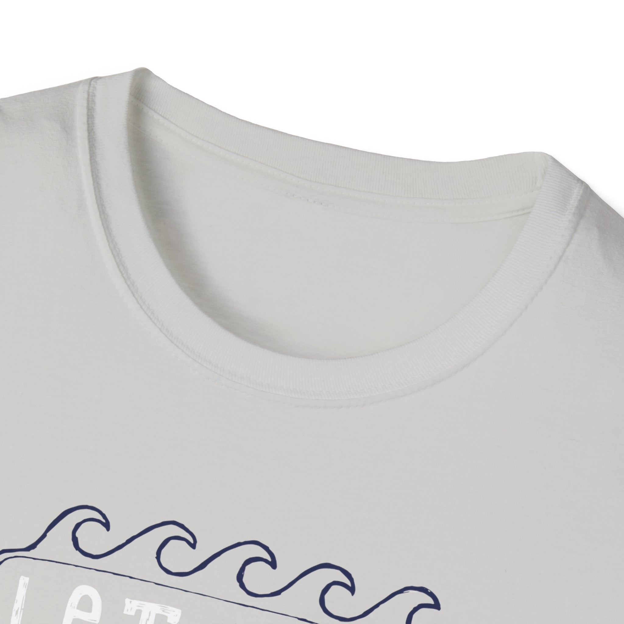 Close-up of the "Let the Waves Take You On a Journey" T-Shirt in light gray, showcasing a round neck and a design featuring blue wave patterns and subtle text that inspire thoughts of self-discovery at hidden destinations.