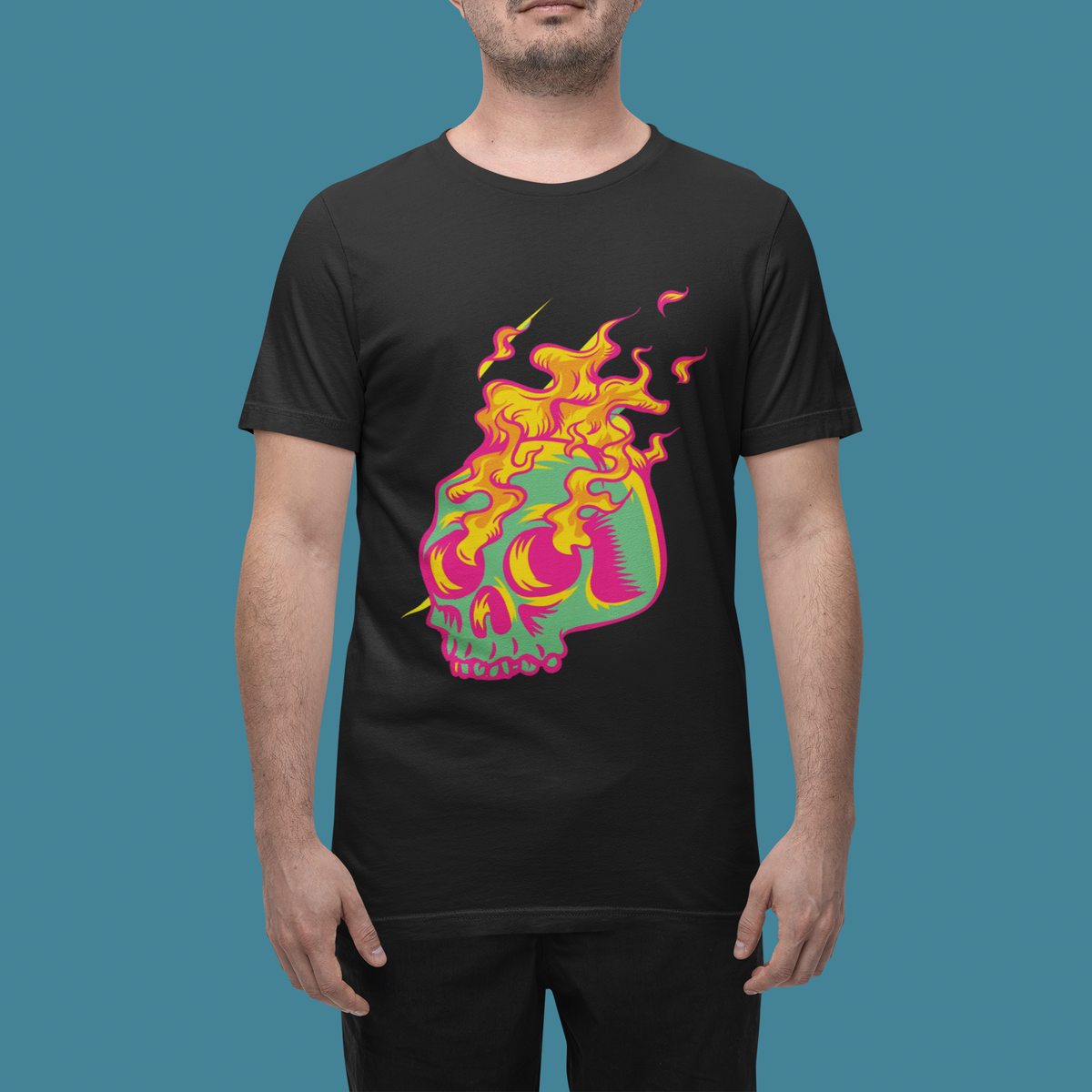 'Skull in Flames' psychedelic skull t-shirt in black, man wearing it against blue backdrop, gothic gift
