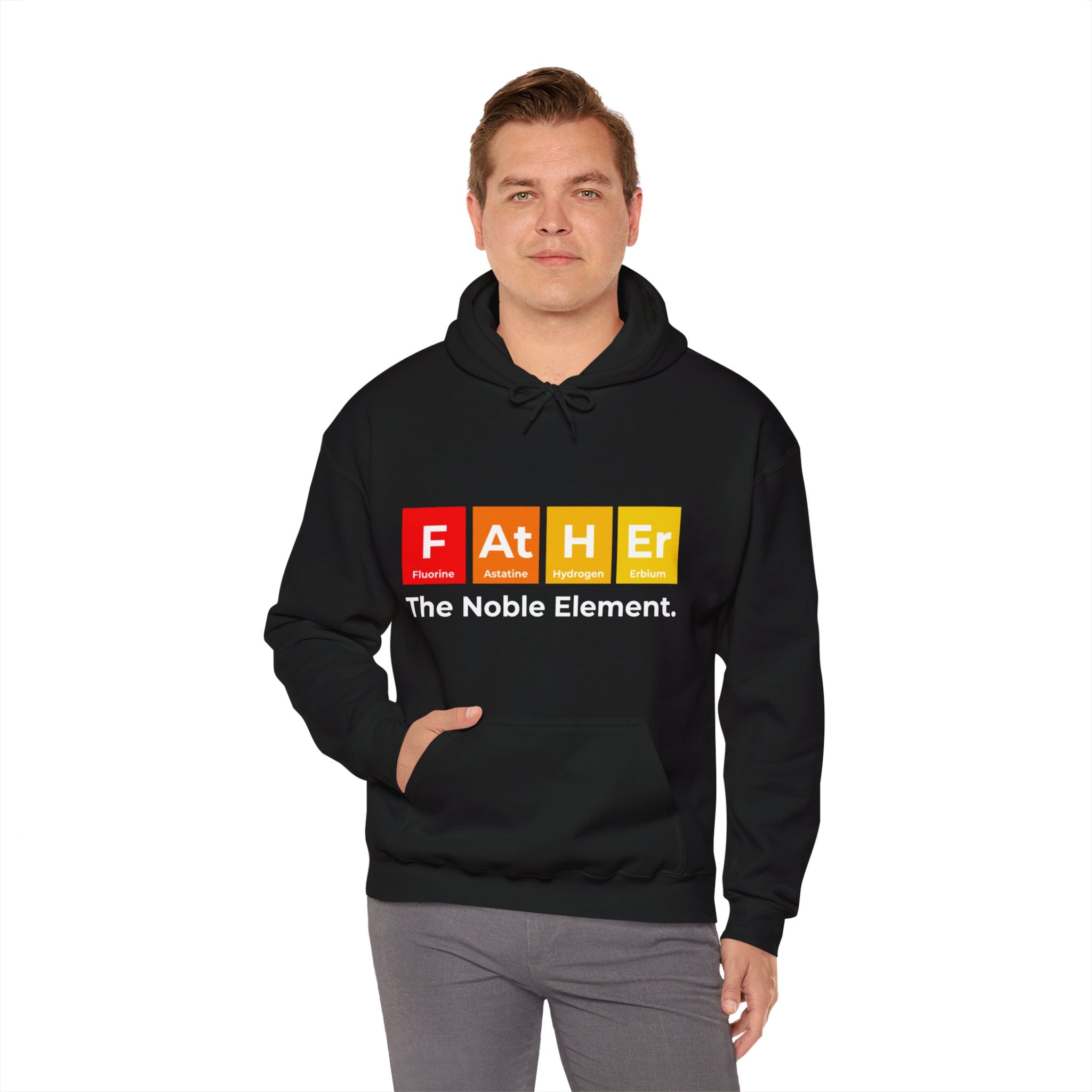 A man is wearing a Father Graphic - Hooded Sweatshirt that reads, "FATHER: The Noble Element," with a periodic table design using elements Fluorine (F), Astatine (At), Hydrogen (H), and Erbium (Er).