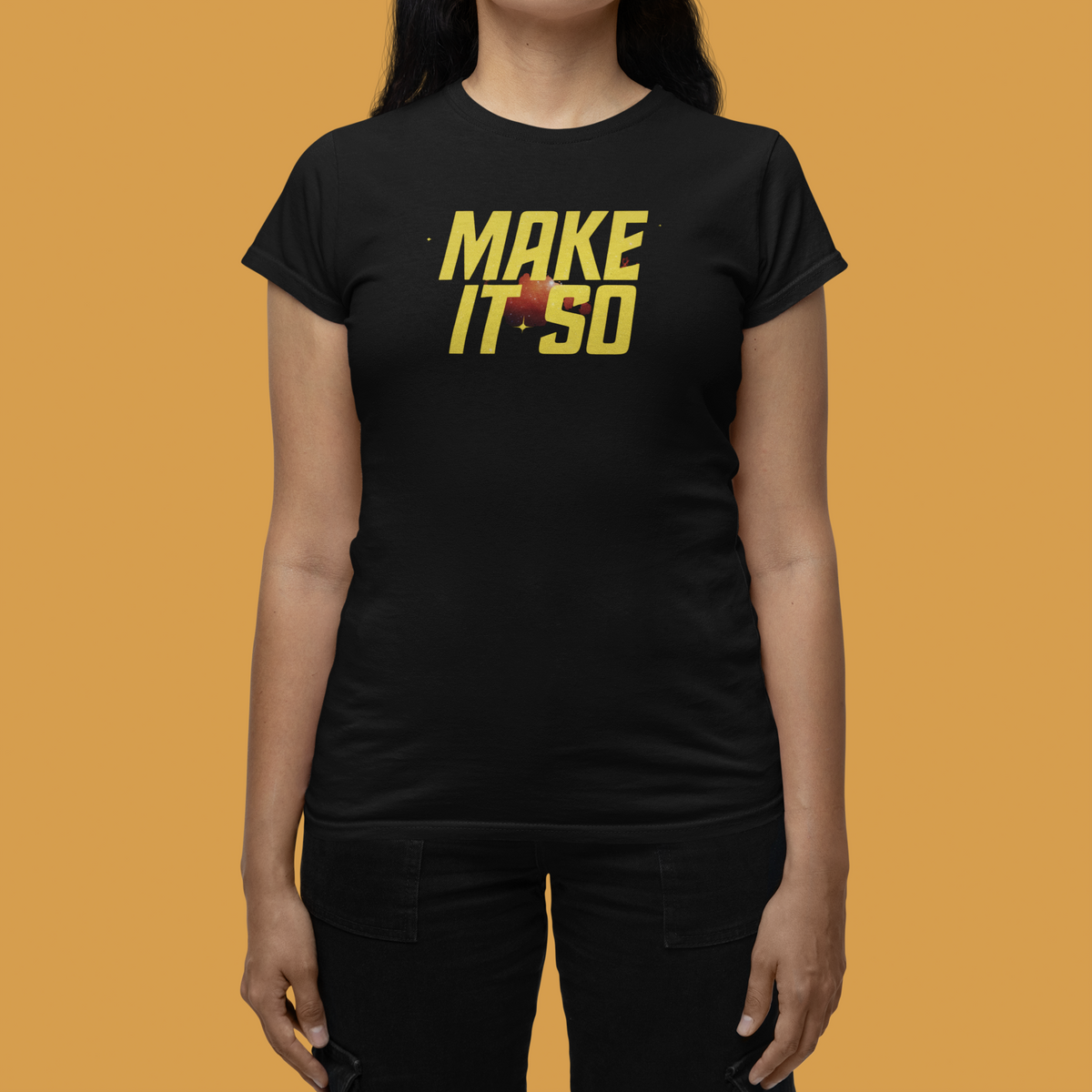 "Make It So" women's tee in black, flat lay on orange background, funny gift for sci-fi fans