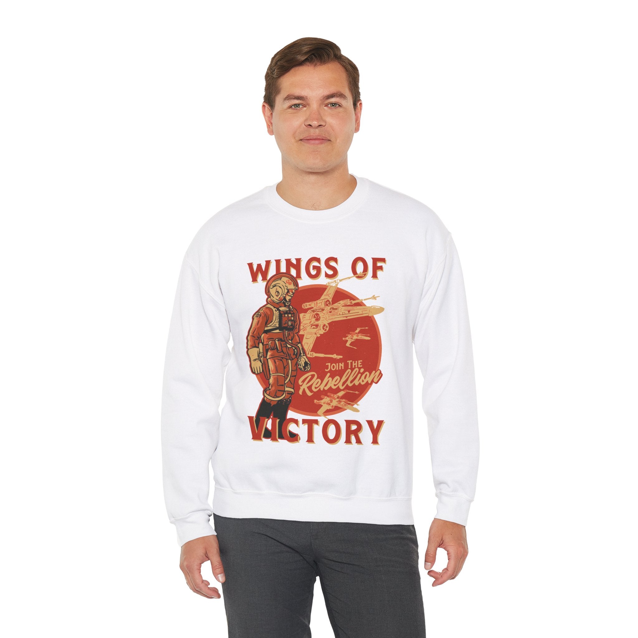 A person wearing a Wings of Victory - Sweatshirt, featuring a design with a character in a spacesuit and the text "Wings of Victory" and "Join the Rebellion," showcasing both comfort and style.