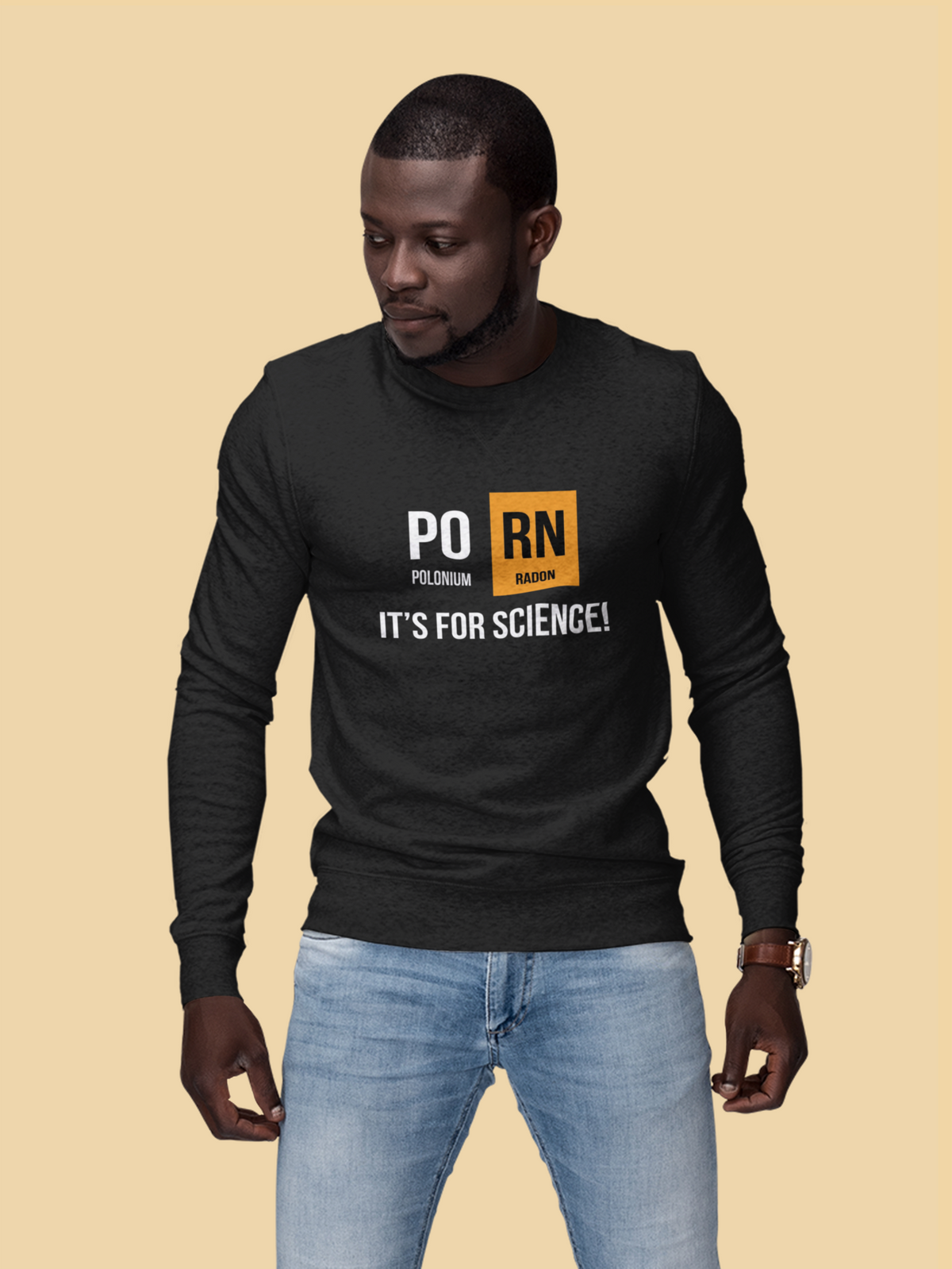 'PO-RN, It's for Science!' periodic table sweatshirt in black, man wearing it on tan background, science gift