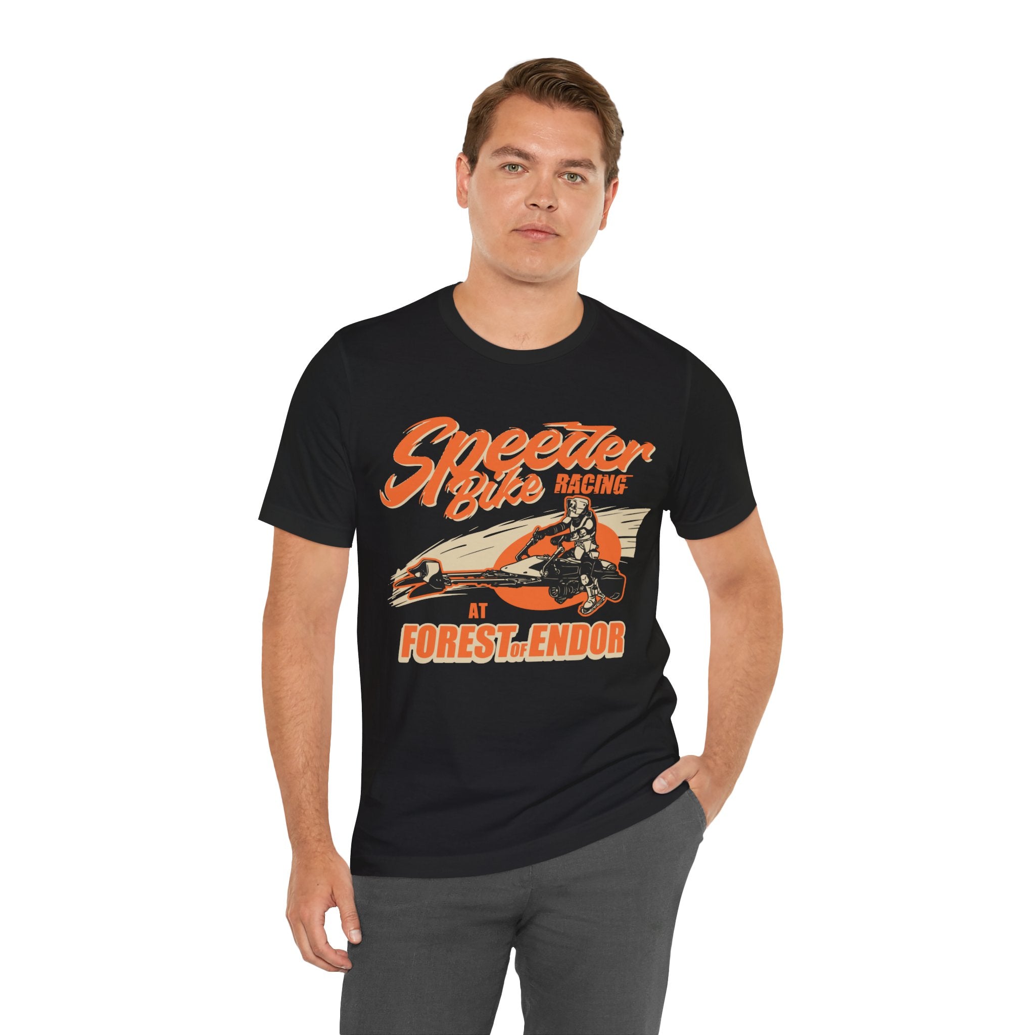 A man wearing a black jersey tee with orange "Speeder Bike Racing" graphic, standing against a white background.