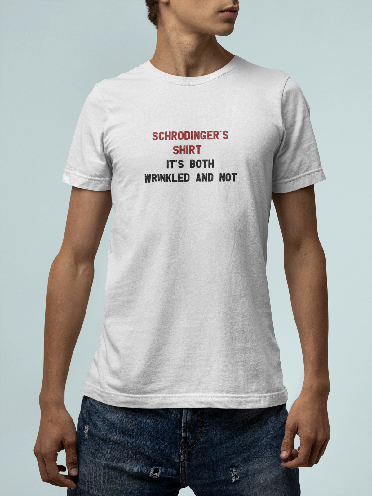 'Schrodinger's Shirt T-Shirt' in white, man against a light backdrop, T-Shirt mockup, Geekpsters