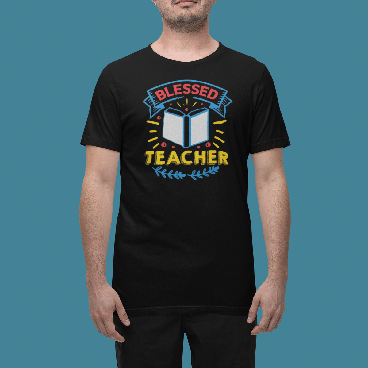 'Blessed Teacher' t-shirt in black, man wearing it in a studio, T-Shirt mockup, Geekpsters
