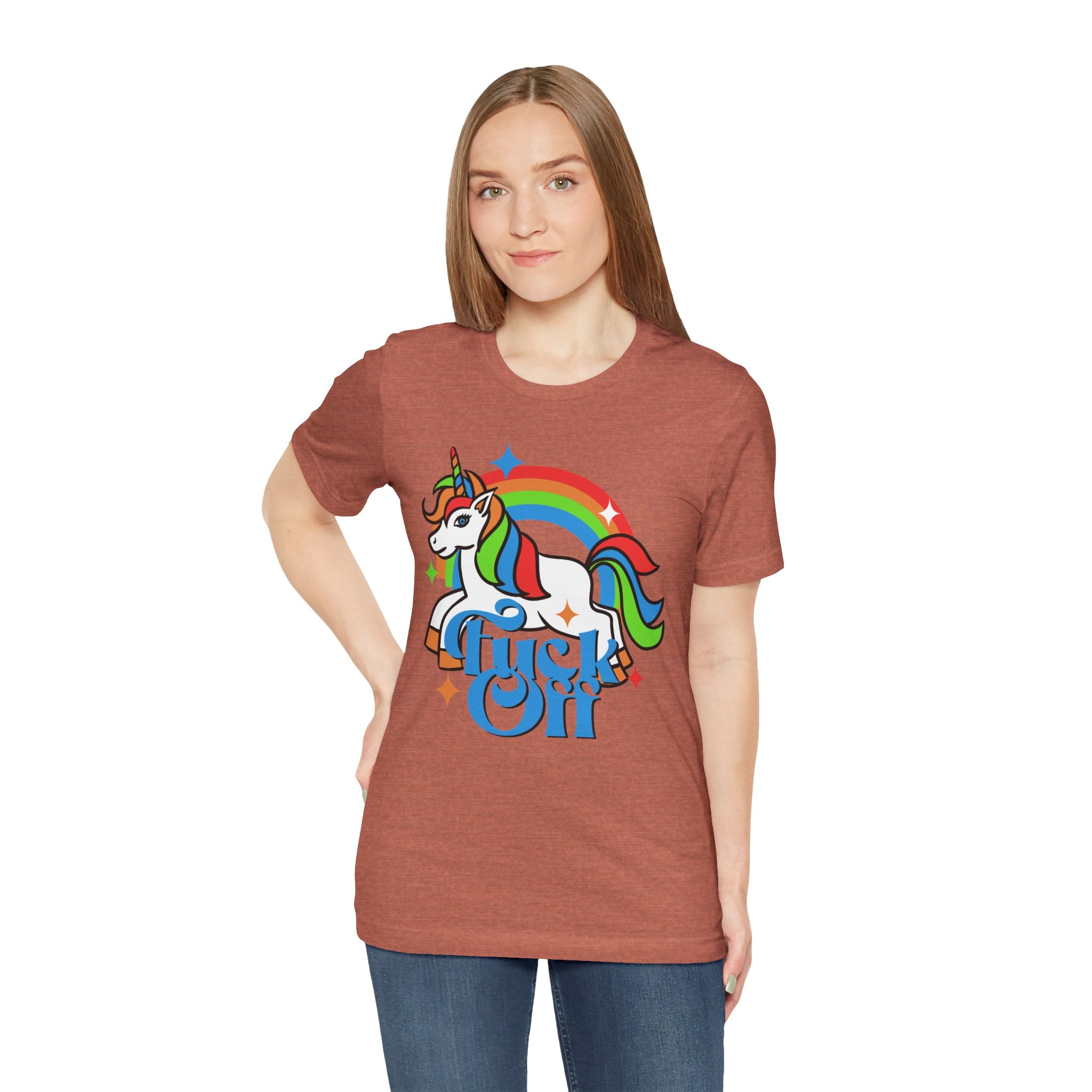 Woman in a cotton brown F off T-shirt featuring a colorful unicorn design above the words "gush off" under a rainbow.
