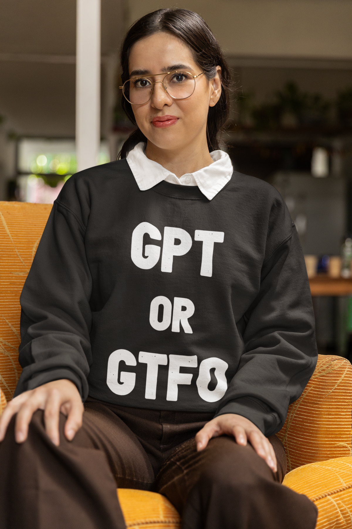 'GPT or GTFO' sweatshirt in dark heather, woman wearing it indoors smiling, funny gift for developers