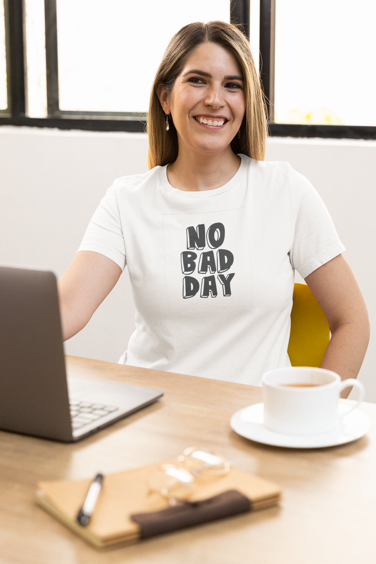 'No Bad Day' t-shirt in white, woman wearing it at an office desk, T-Shirt mockup, Geekpsters