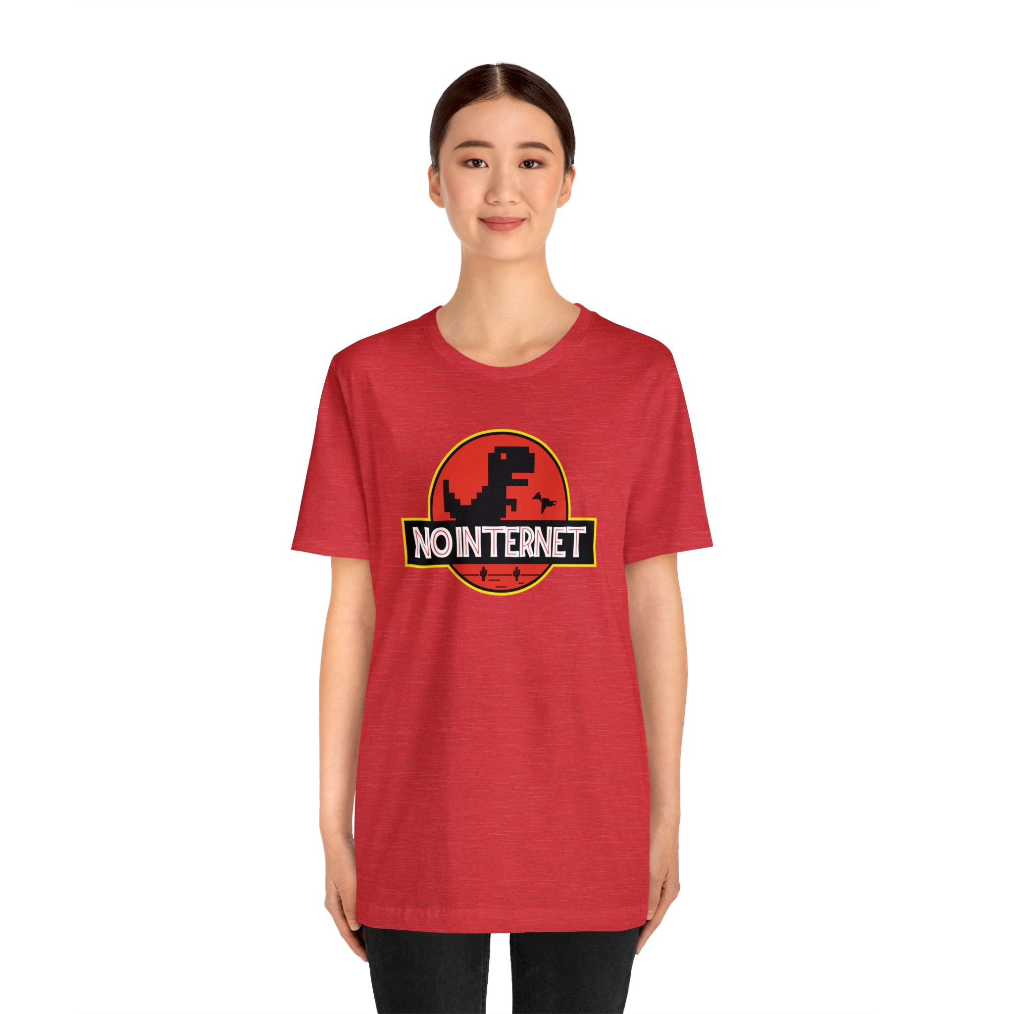 A geekpster woman wearing a red t-shirt that says No Internet.