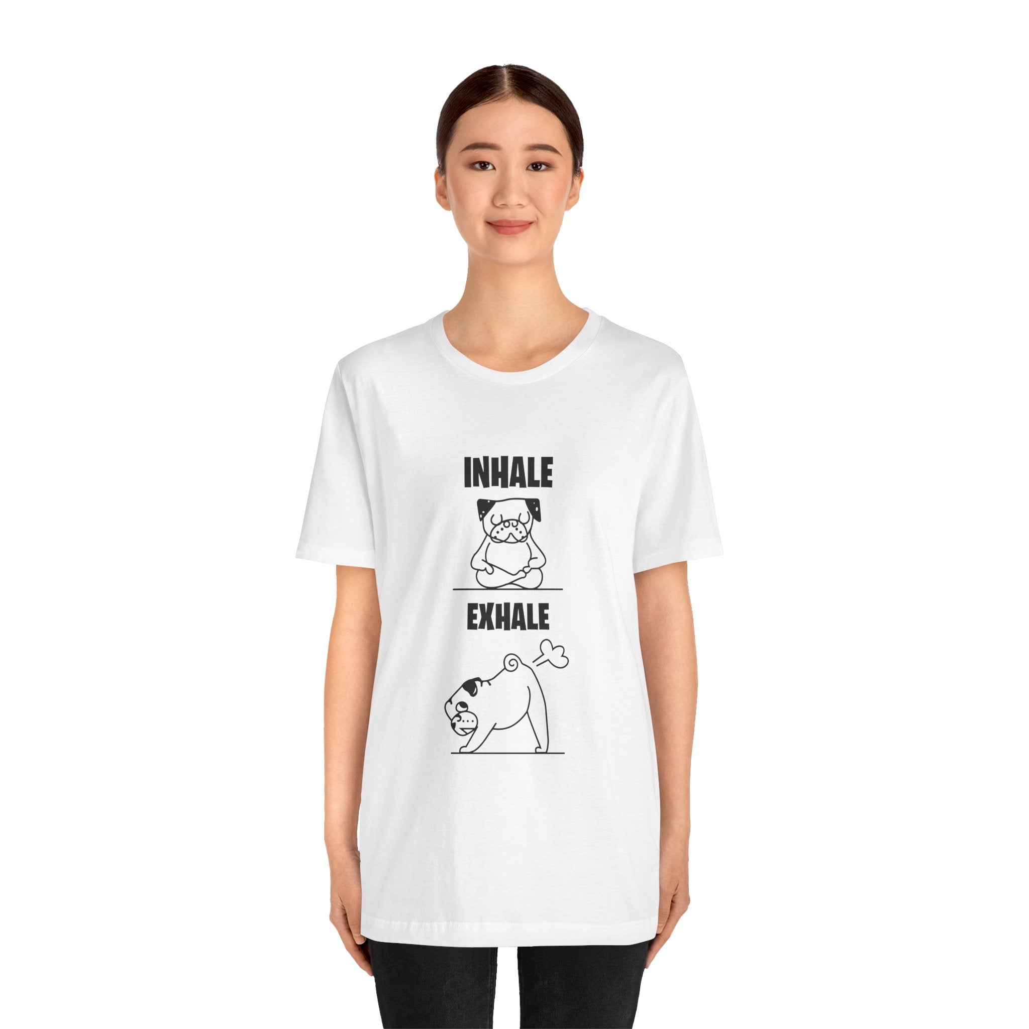 A young woman wearing a Dog Funny T shirt with a quality print cartoon of a dog performing yoga on the front, labeled "inhale exhale.