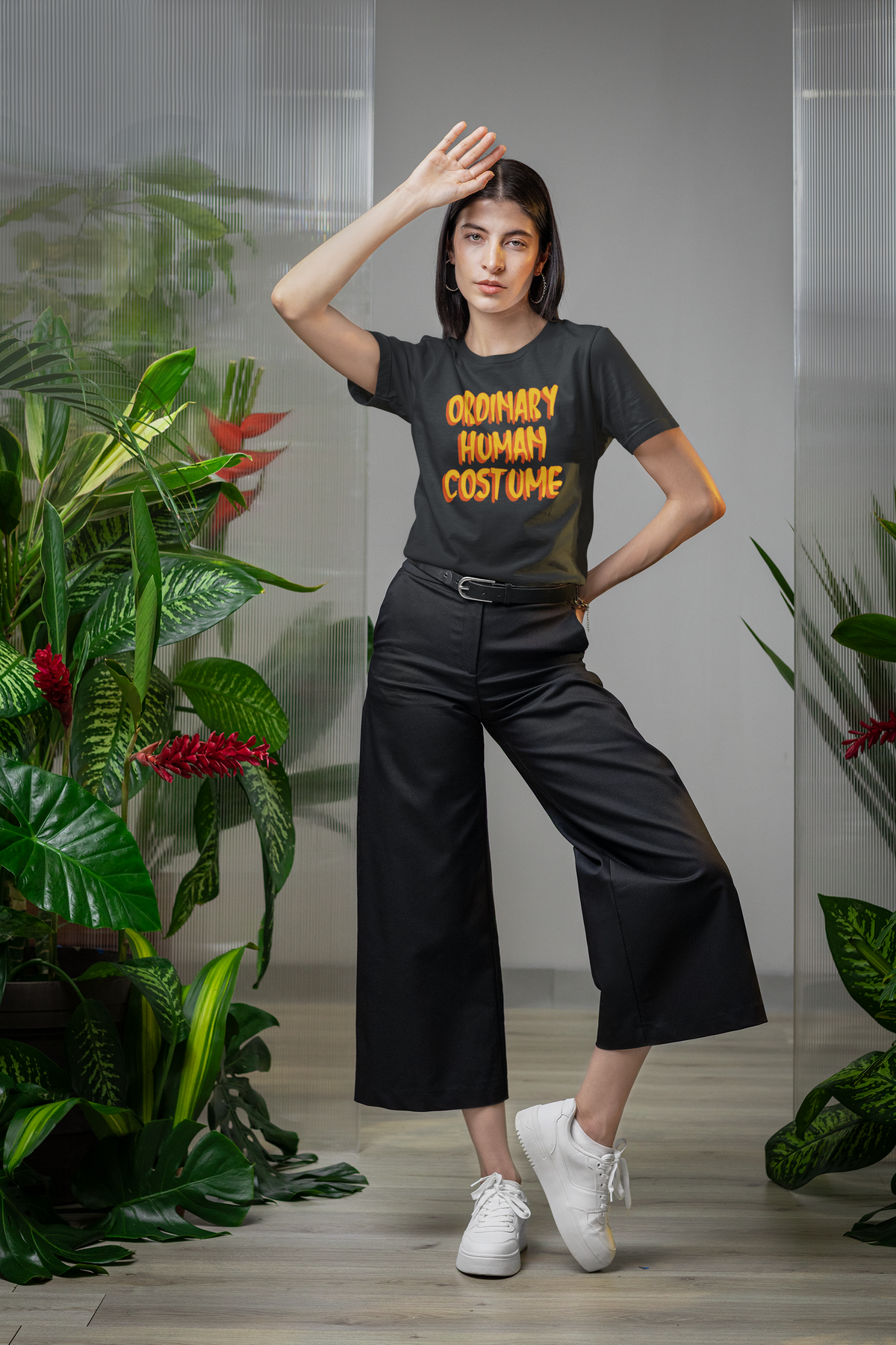 'Ordinary Human Costume' funny halloween t-shirt in black, woman wearing it outdoors, funny costume gift