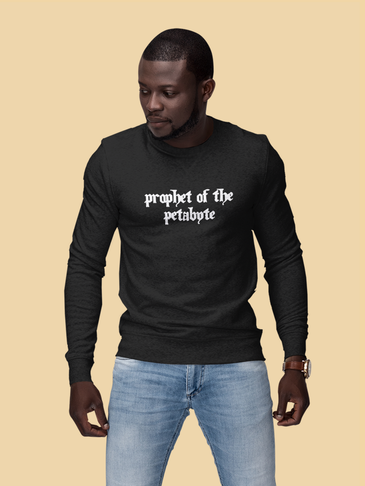 'Prophet of the Petabyte' sweatshirt in black, man wearing it on tan background, funny tech sweatshirt gift