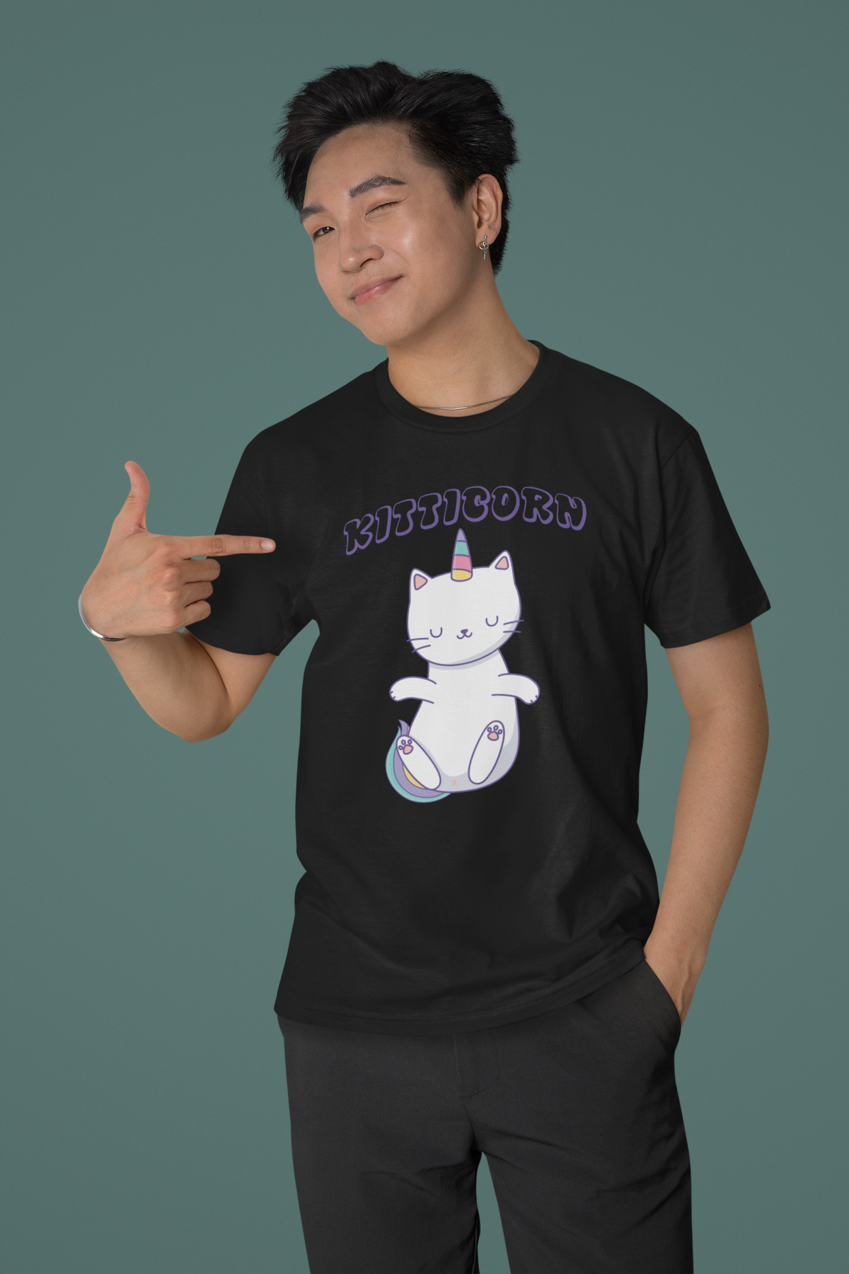 "Kitticorn" unicorn cat graphic t-shirt in black, man wearing it pointing at print, cute gift for cat lovers