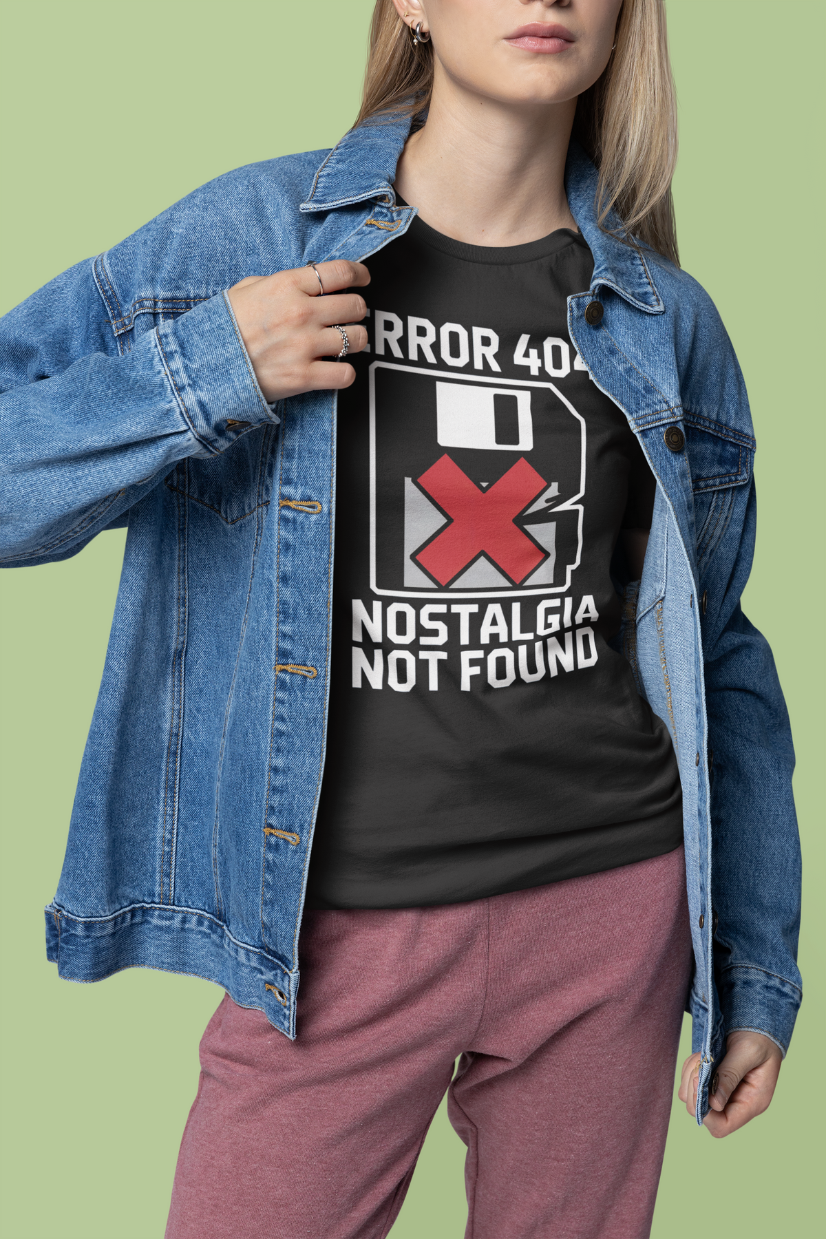 'Error 404 Nostalgia Not Found' t-shirt in black, woman wearing it under denim jacket, funny geek gift