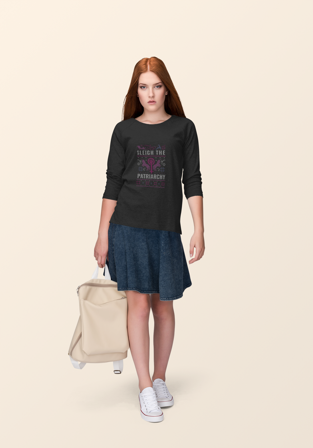 'Sleigh the Patriarchy' ugly sweater sweatshirt in black, woman wearing it outdoors, feminist gift