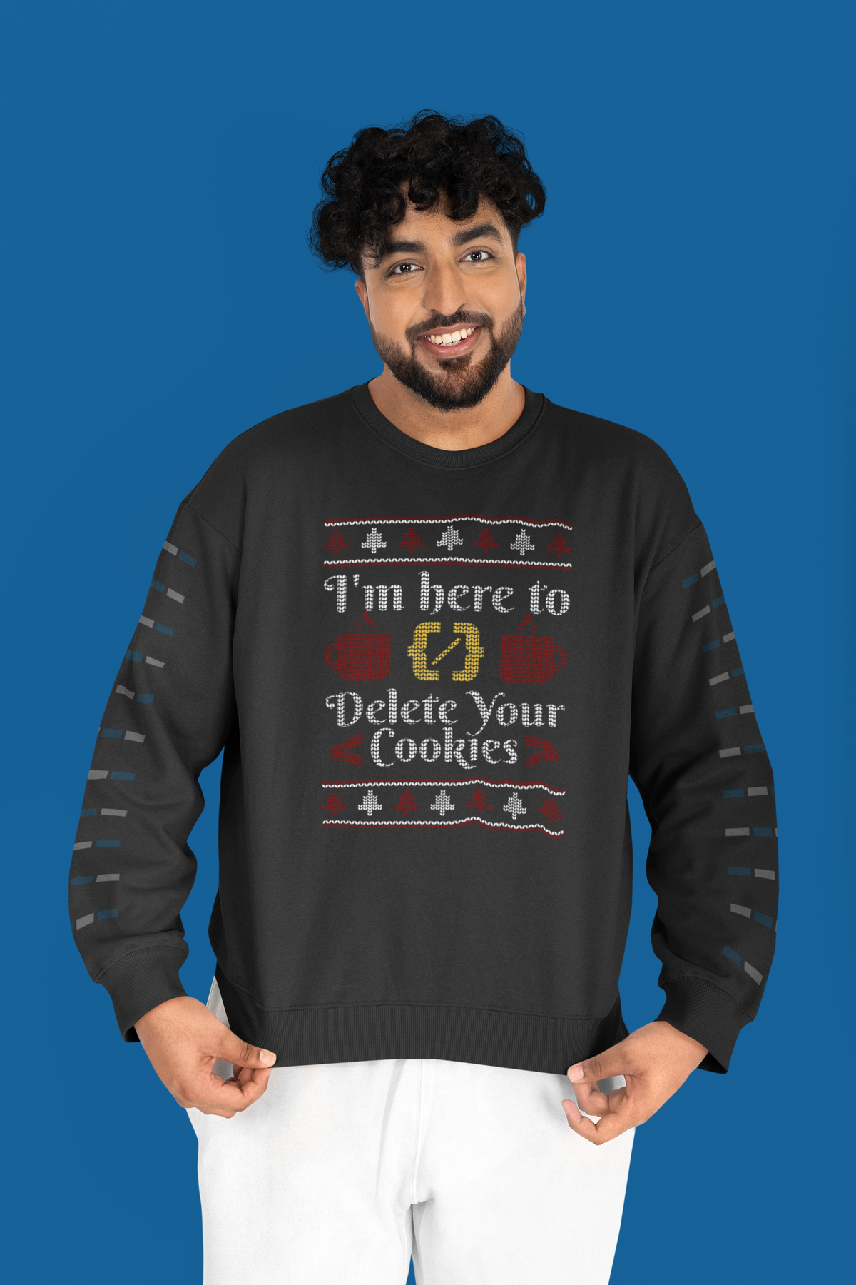 'I'm Here to Delete Your Cookies' sweatshirt in black, man wearing it against blue studio backdrop, funny coder gift