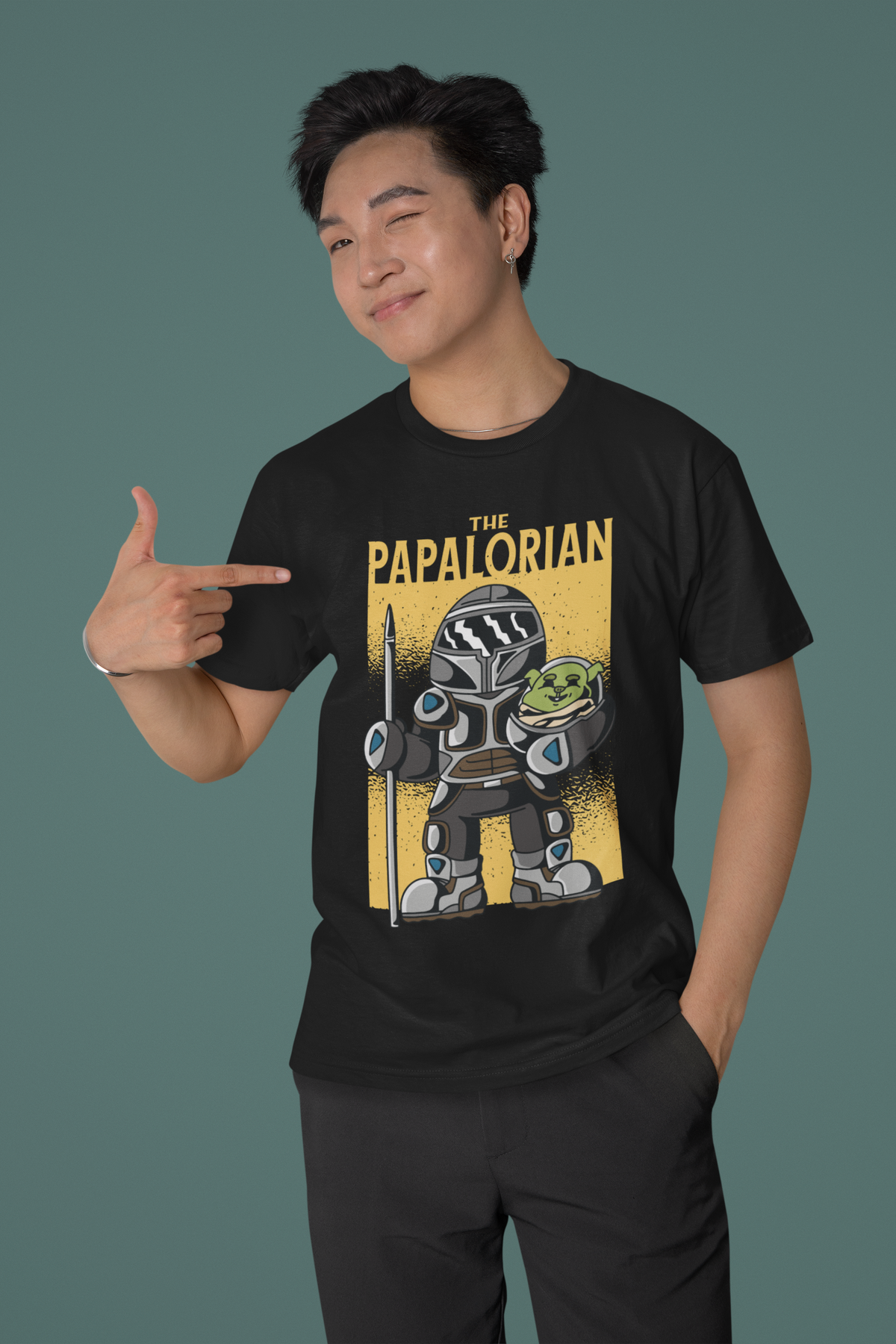 'The Papalorian' t-shirt in black, man model wearing it against a dark green background, funny father's day gift