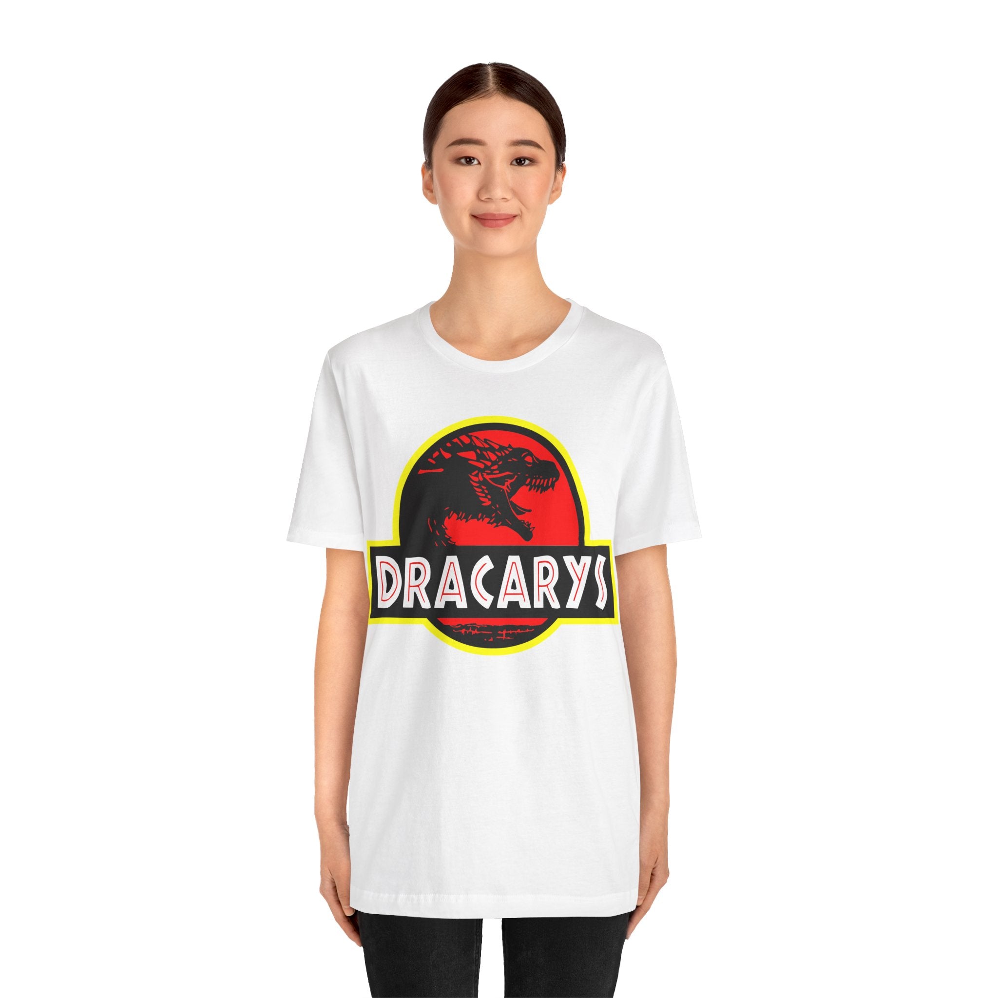 A young woman wearing a white Dracarys T-Shirt featuring a high-quality print of a dragon silhouette.