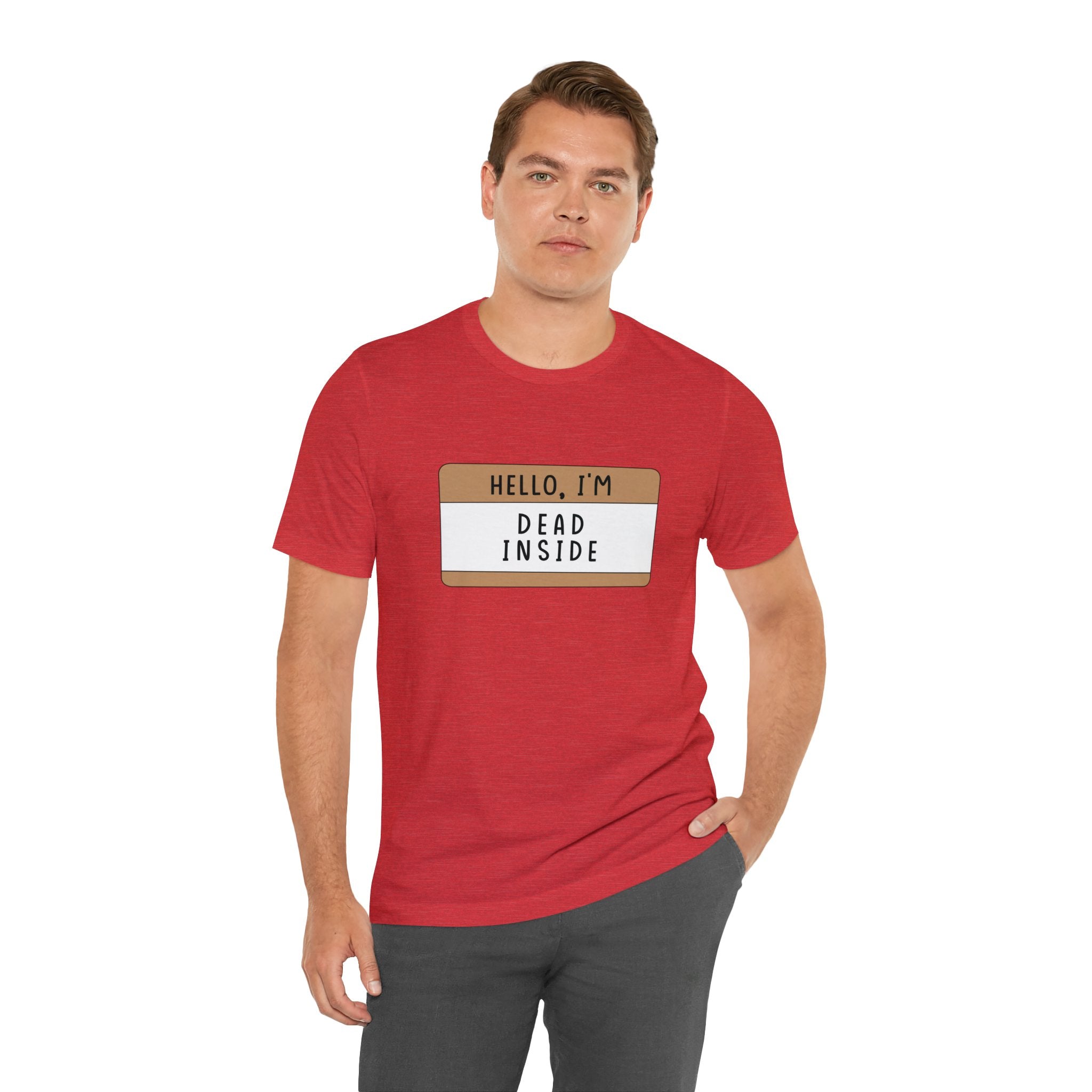 Man in a red "Hello, I'm Dead Inside" t-shirt, standing against a white background.