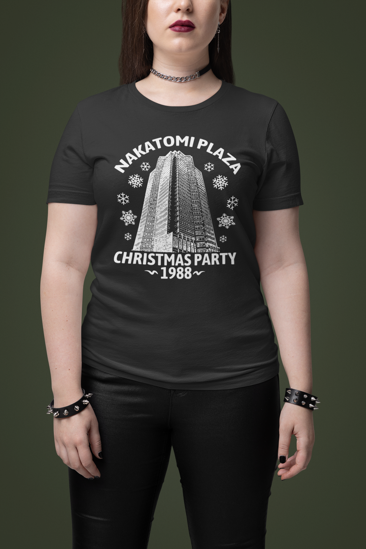 'Nakatomi Plaza Christmas Party 1988' t-shirt in black, woman wearing it, Christmas movie fan gift