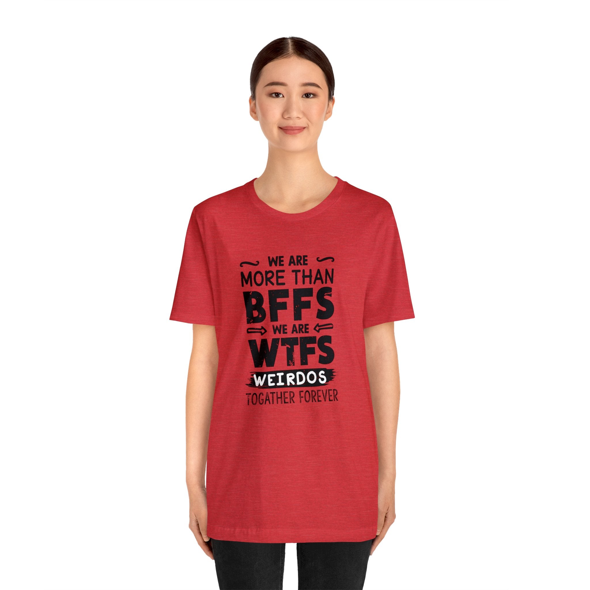A woman wearing a red We Are More T-Shirt with the text "be more than bffs" on it.